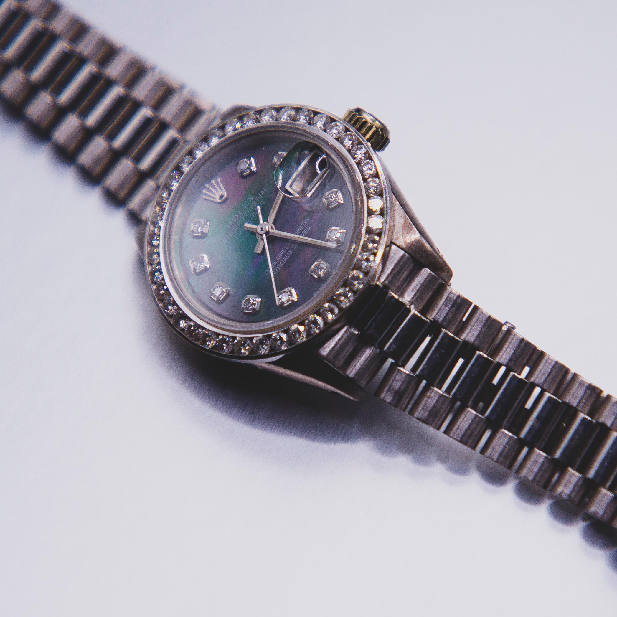 18k White gold Ladies Rolex President Model number 6917. Bracelet is in rare excellent condition, 31 links showing virtually no sag or stretching and is at about 95% + new condition.  White gold bezel is channel- set with 38 round brilliant full cut