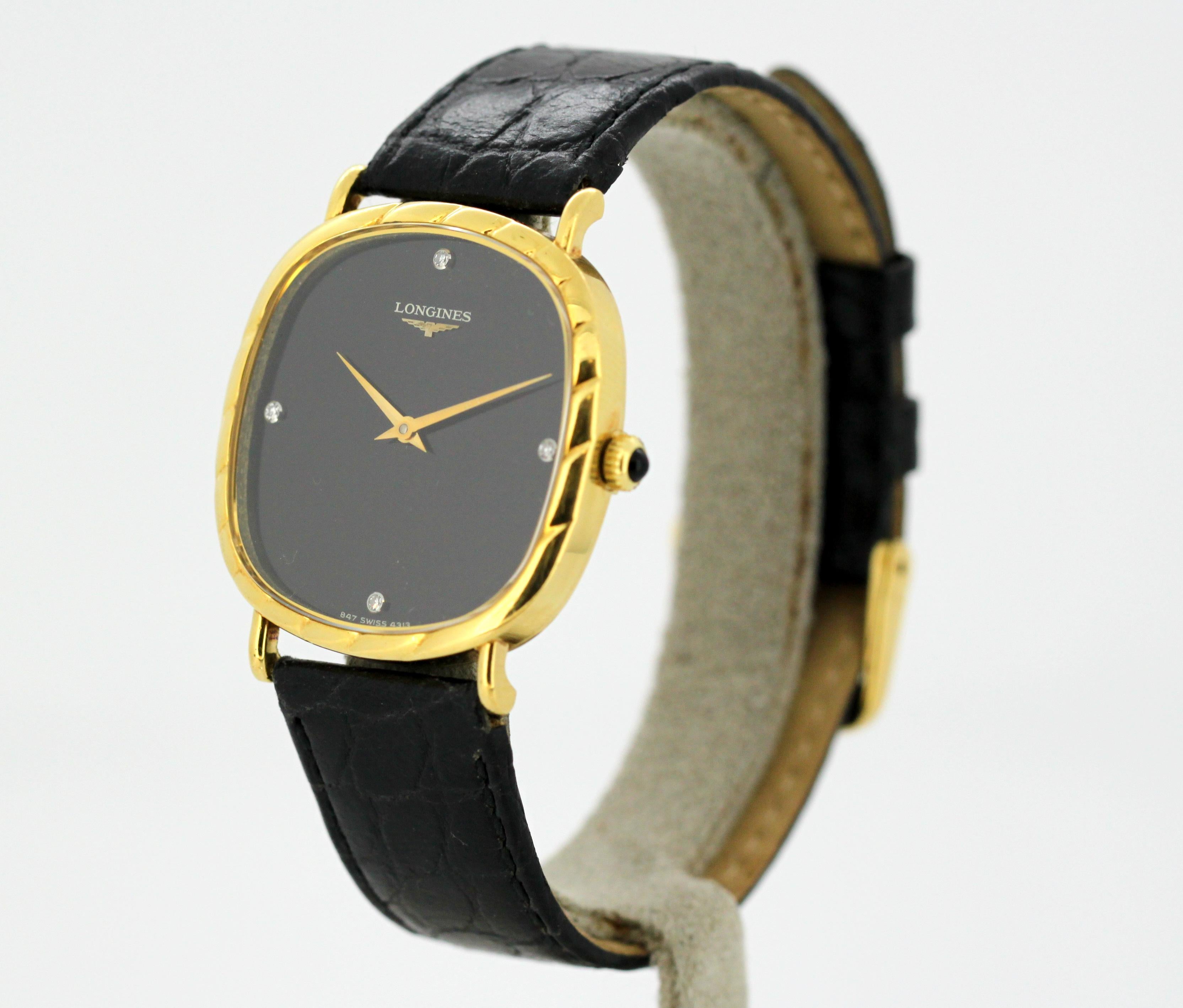 Ladies 18k gold and black dial Longines wristwatch, set with diamond hour markers.
Circa 1990's

Gender: Ladies
Case size: 37  mm
Movement: Manual winding
Watchband Material: Original Longines Leather
Case material : 18K Gold
Display
