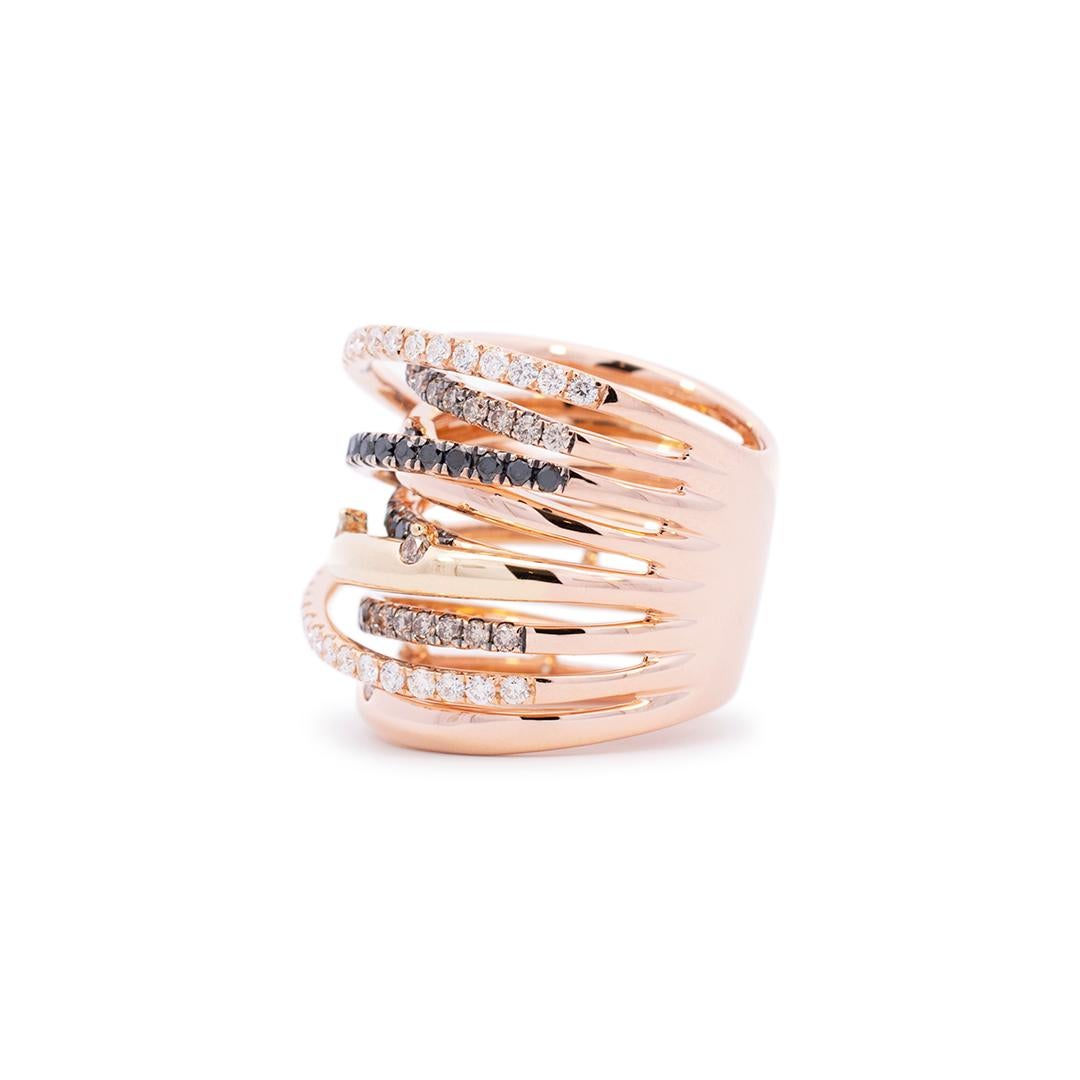 One ladies custom made polished 18K rose gold, diamond cocktail ring with a half round shank. The ring is a size 6.5, Each one of the Orbits is 1.90mm thick up to 2.90mm. Total eight Orbits measure approximately 21.50mm tapering to 14.00mm in width