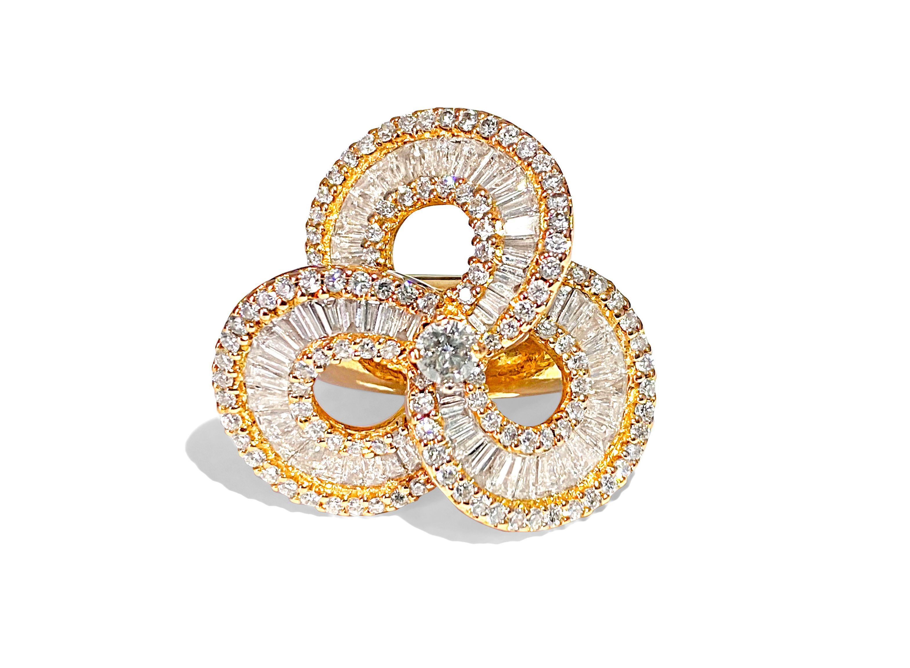 In 18k rose gold, this exquisite ring showcases a total of 5.00 carats of diamonds, featuring a mix of round brilliant and baguette cuts with VS2-SI1 clarity. Weighing 13.20 grams and sized at 6.50, it exudes exceptional luster and shine, making it