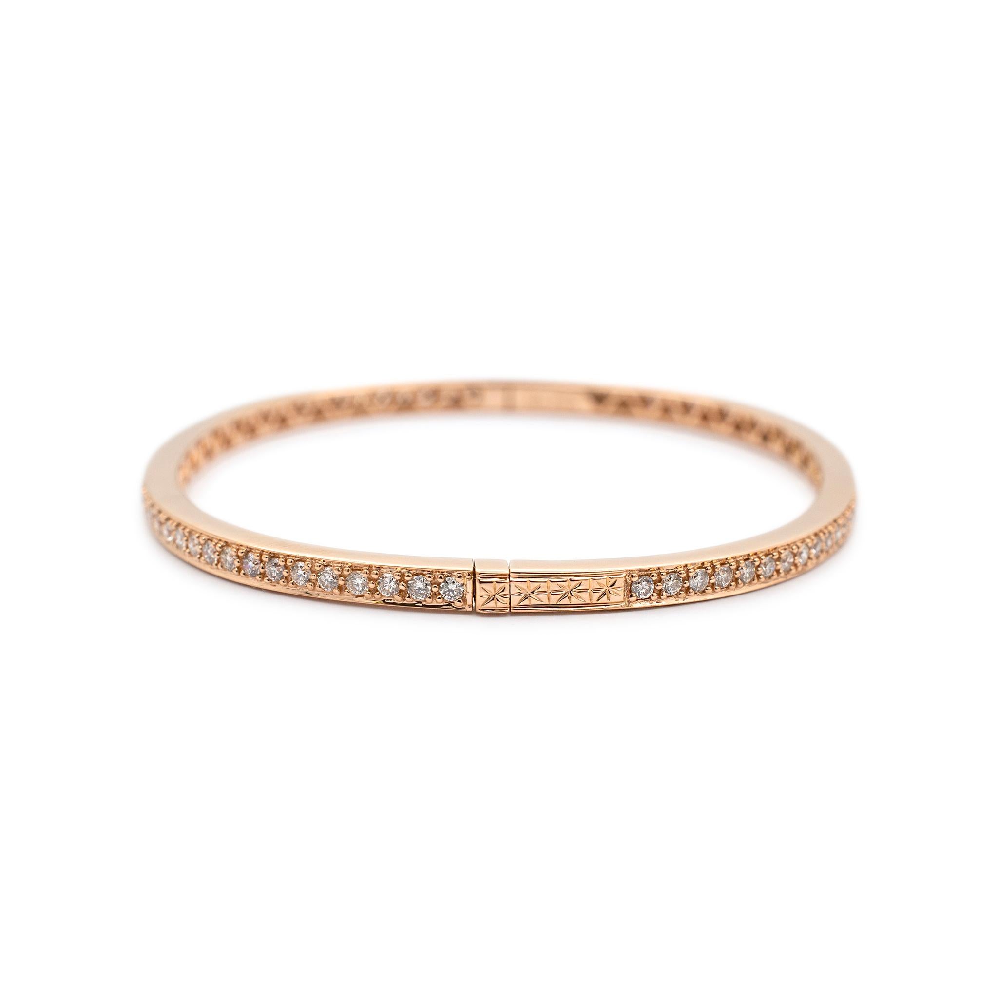 Gender: Ladies

Metal Type: 18K Rose Gold

Length: 6.25 inches

Width: 2.95 mm

Weight:  12.56 grams

18K rose gold diamond bangle bracelet. The metal was tested and determined to be 18K rose gold. Engraved with 