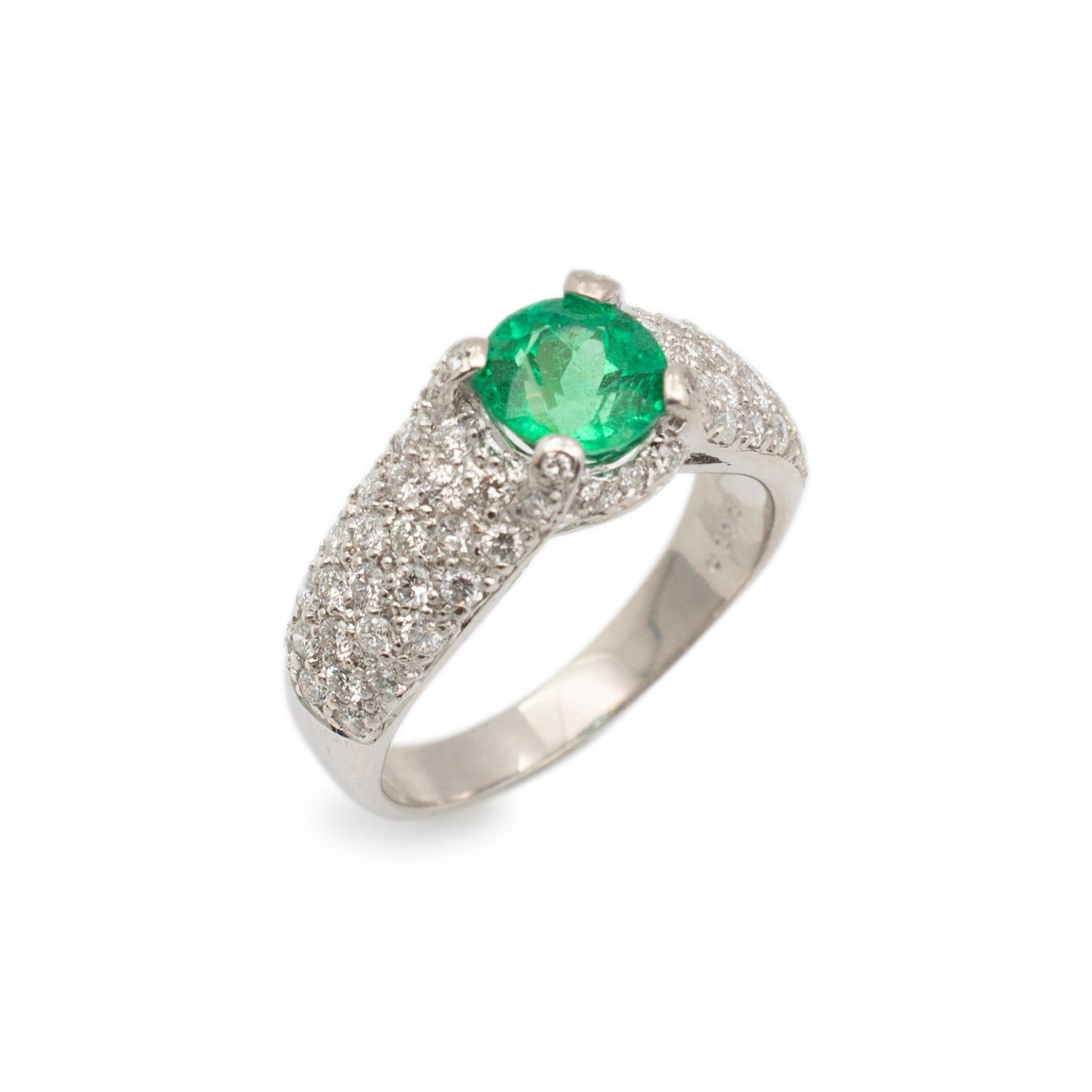 Gender: Ladies

Metal Type: 18K White Gold

Size: 7

Shank Maximum Width: 8.40 mm tapering to 2.95 mm

Weight: 6.02 grams

Ladies 18K white gold diamond and emerald cocktail ring with a half round shank. Engraved with 