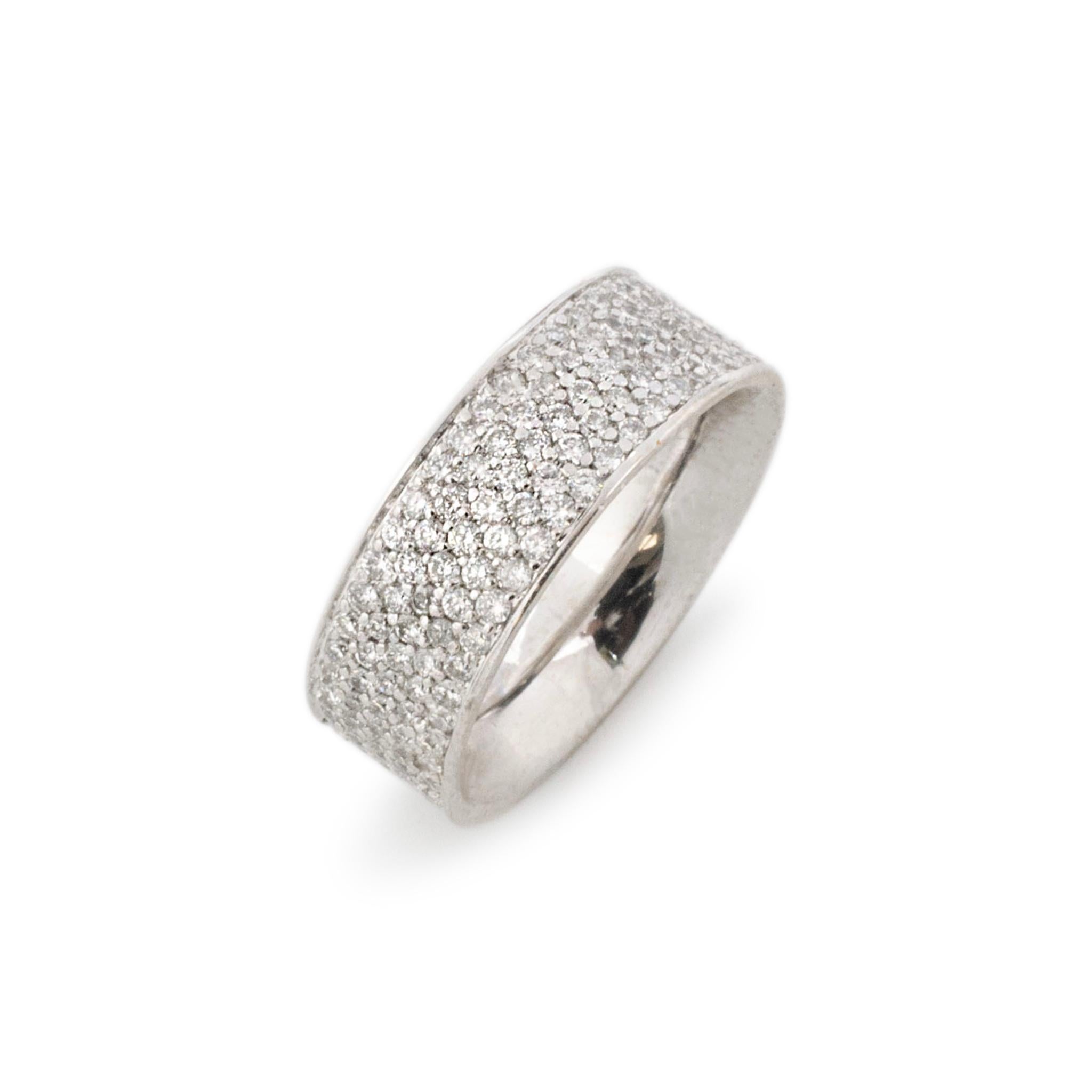 Gender: Ladies

Metal Type: 18K White Gold

Size: 6.5

Shank Maximum Width: 7.60 mm

Weight: 9.02 grams

Ladies 18K white gold diamond cluster eternity wedding band with a comfort-fit shank.  Engraved with 