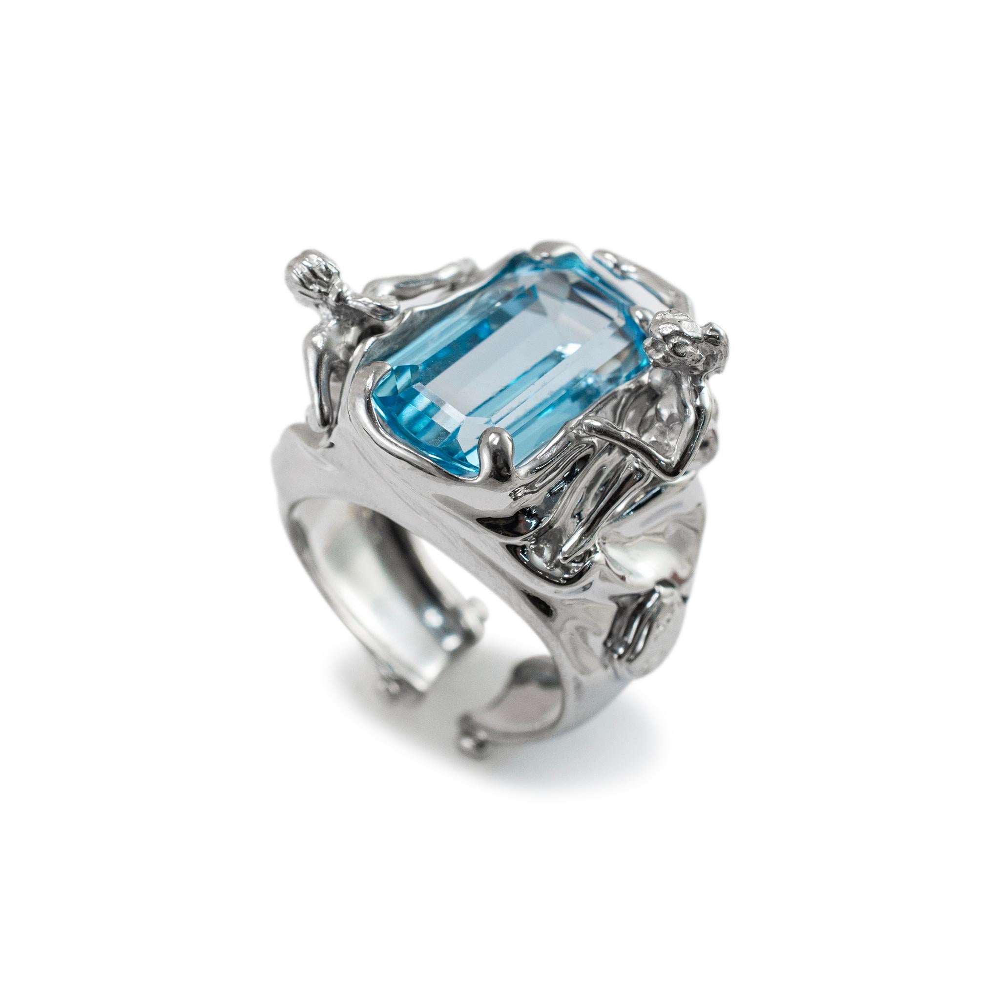 Gender: Ladies 

Metal Type: 18K White Gold

Ring Size: 6.5

Width: 14.90 mm tapering to 6.70 mm

Weight: 16.77 grams

One ladies Rhodium-plated 18K white gold topaz cocktail ring, Engraved with 
