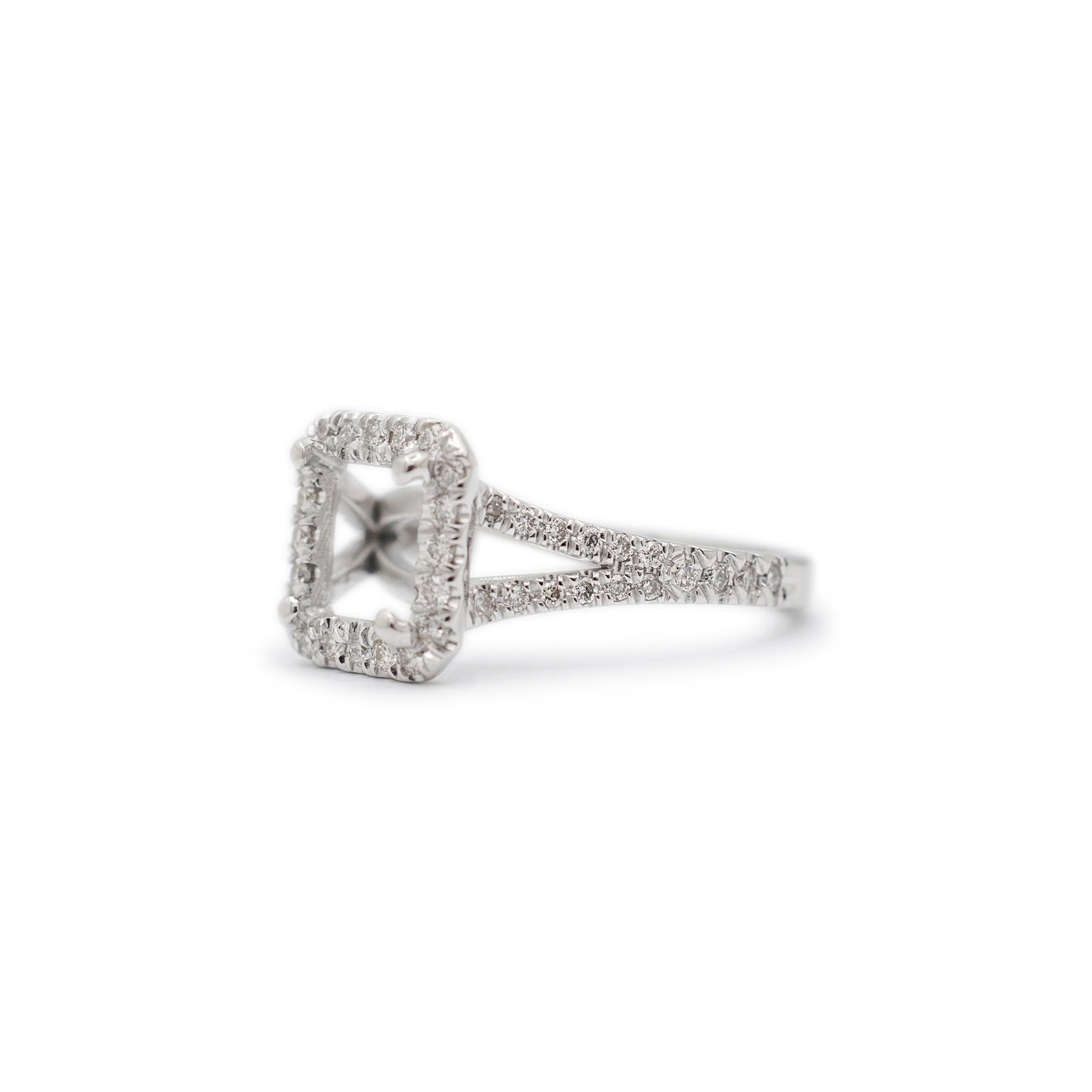 Gender: Ladies

Metal Type: 18K White Gold

Ring Size: 7

Shank Maximum Width: 2.40 mm

Weight: 4.00 grams

Ladies 18K White Gold diamond semi-mount engagement, accented, halo ring with a half round shank. The metal was tested and determined to be