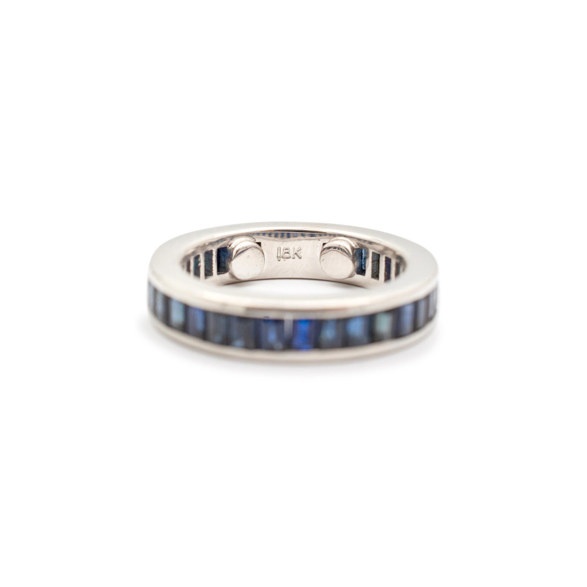 Gender: Ladies

Metal Type: 18K White Gold

Size: 5.5

Shank Maximum Width: 4.80 mm

Weight: 6.70 grams

Ladies 18K white gold sapphire eternity band with a soft-square shank. Engraved with 