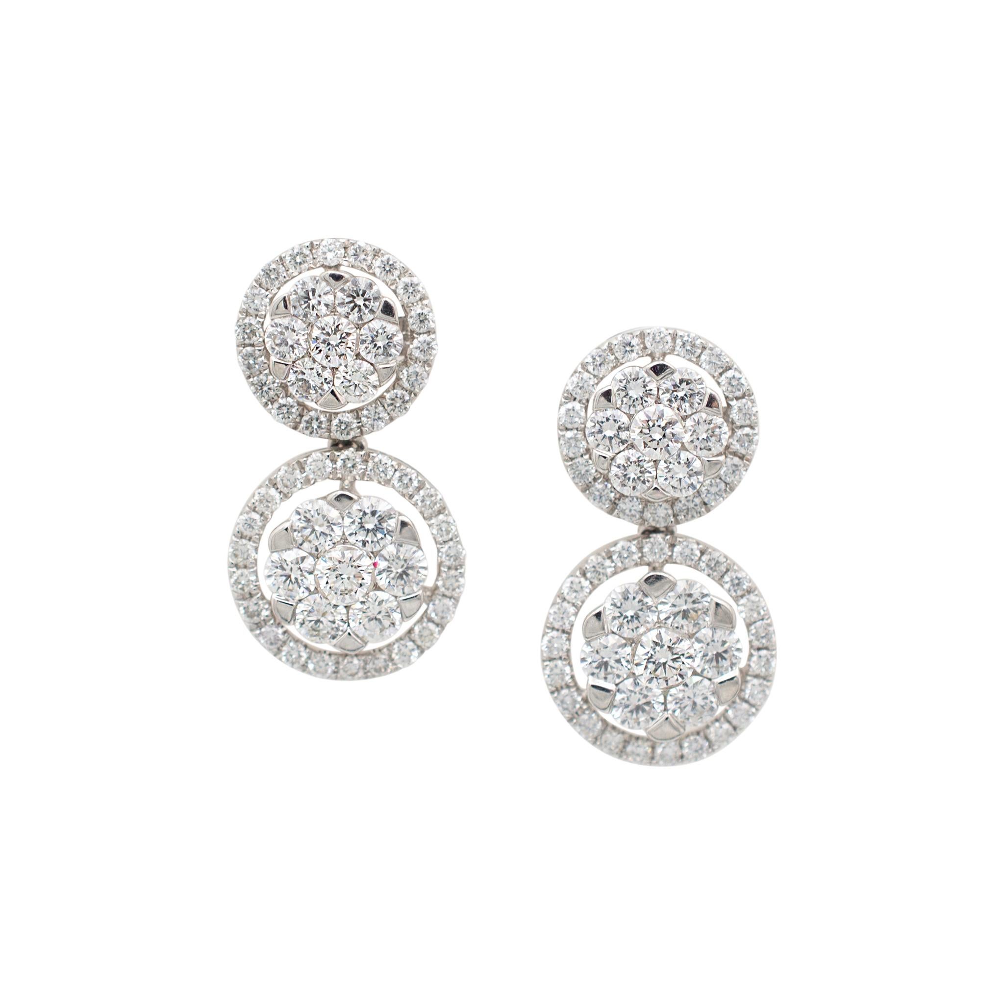 Gender: Ladies

Metal Type: 18K White Gold

Lenght: 0.75 inches

Weight:  5.67 grams

One pair of ladies 18K white gold, diamond halo, drop, cluster, stud, dangle earrings with push backs. The metal was tested and determined to be 18K white gold.