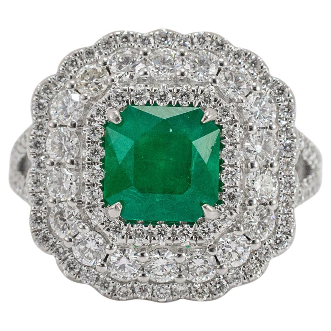 Ladies 18K White Gold Emerald Triple Halo Accented Diamond Cocktail Ring
