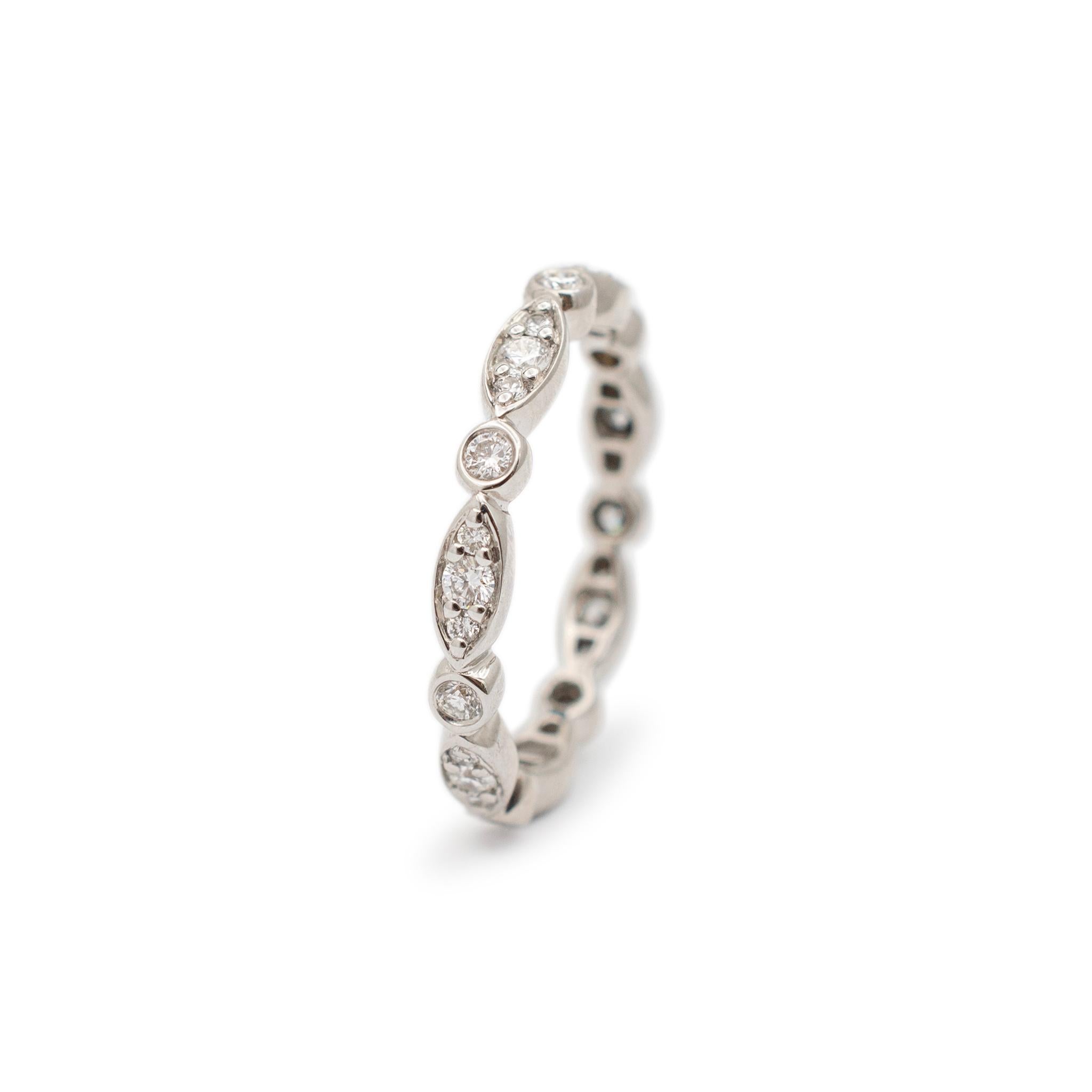 Gender: Ladies

Metal Type: 18K White Gold

Size: 6.5

Shank Width: 3.00mm

Weight: 2.90 grams

Ladies 18K white gold diamond wedding eternity band with a half-round shank. Engraved with 