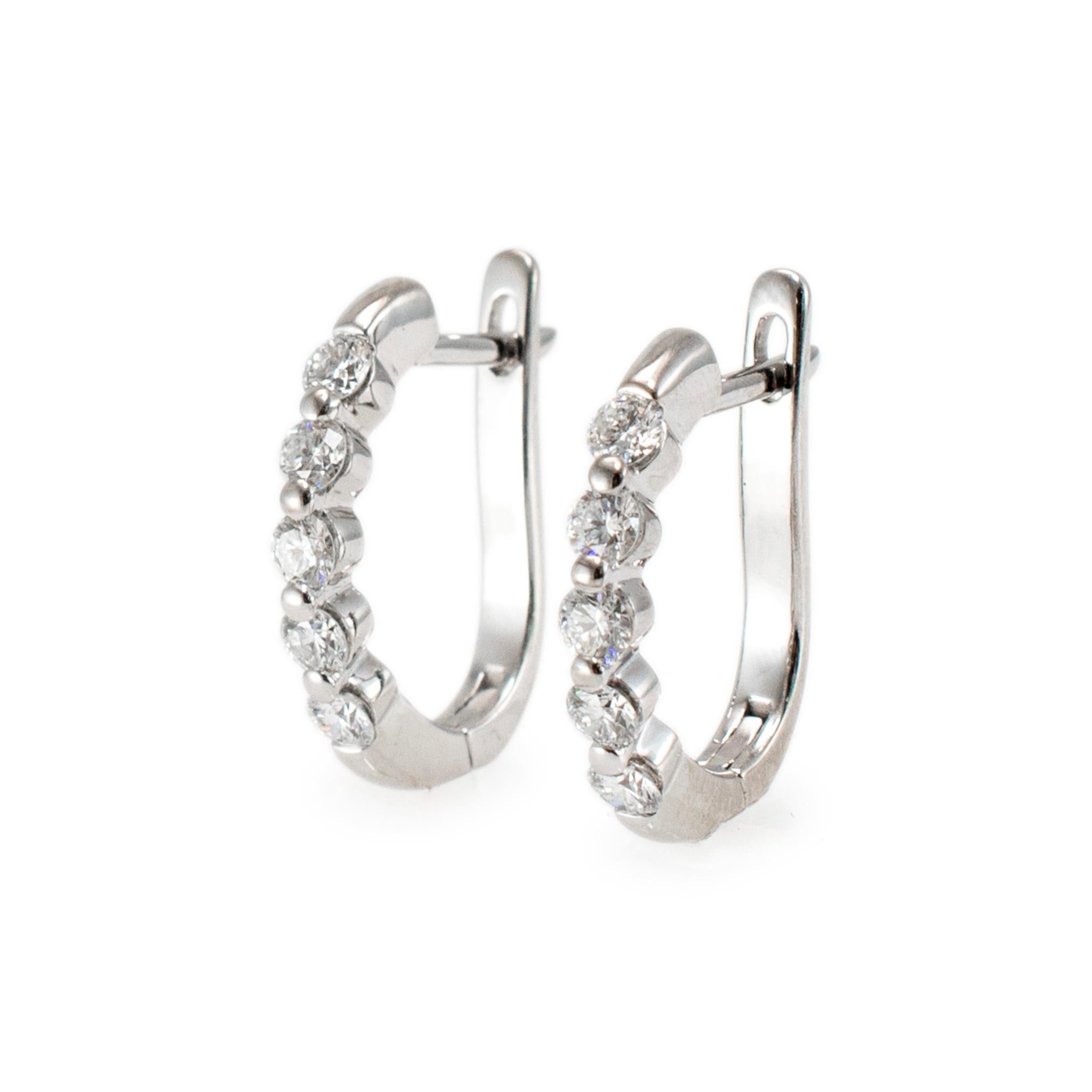 Gender: Ladies 

Metal Type: 18K White Gold

Length: 0.75 inches

Width: 14.15 mm

Weight: 4.87 grams 

One pair of ladies 18K white gold diamond hoop earrings with 
