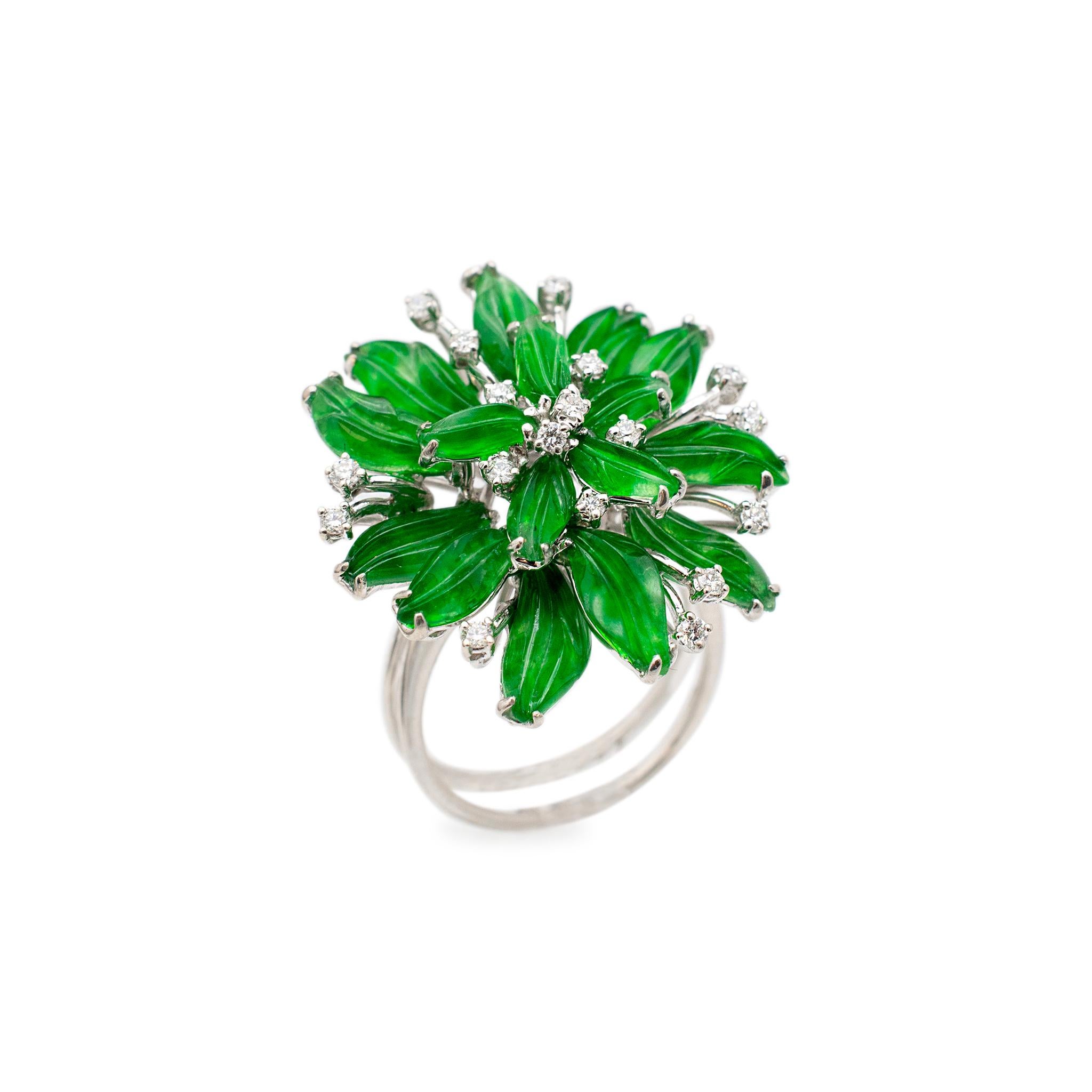 Gender: Ladies

Metal Type: 18K White Gold

Size: 6.5

Shank maximum width: 5.00 mm

Diameter: 25.00 mm

Weight: 9.82 grams

18K white gold diamond and jade cocktail ring with a split-shank. The metal was tested and determined to be 18K white gold.