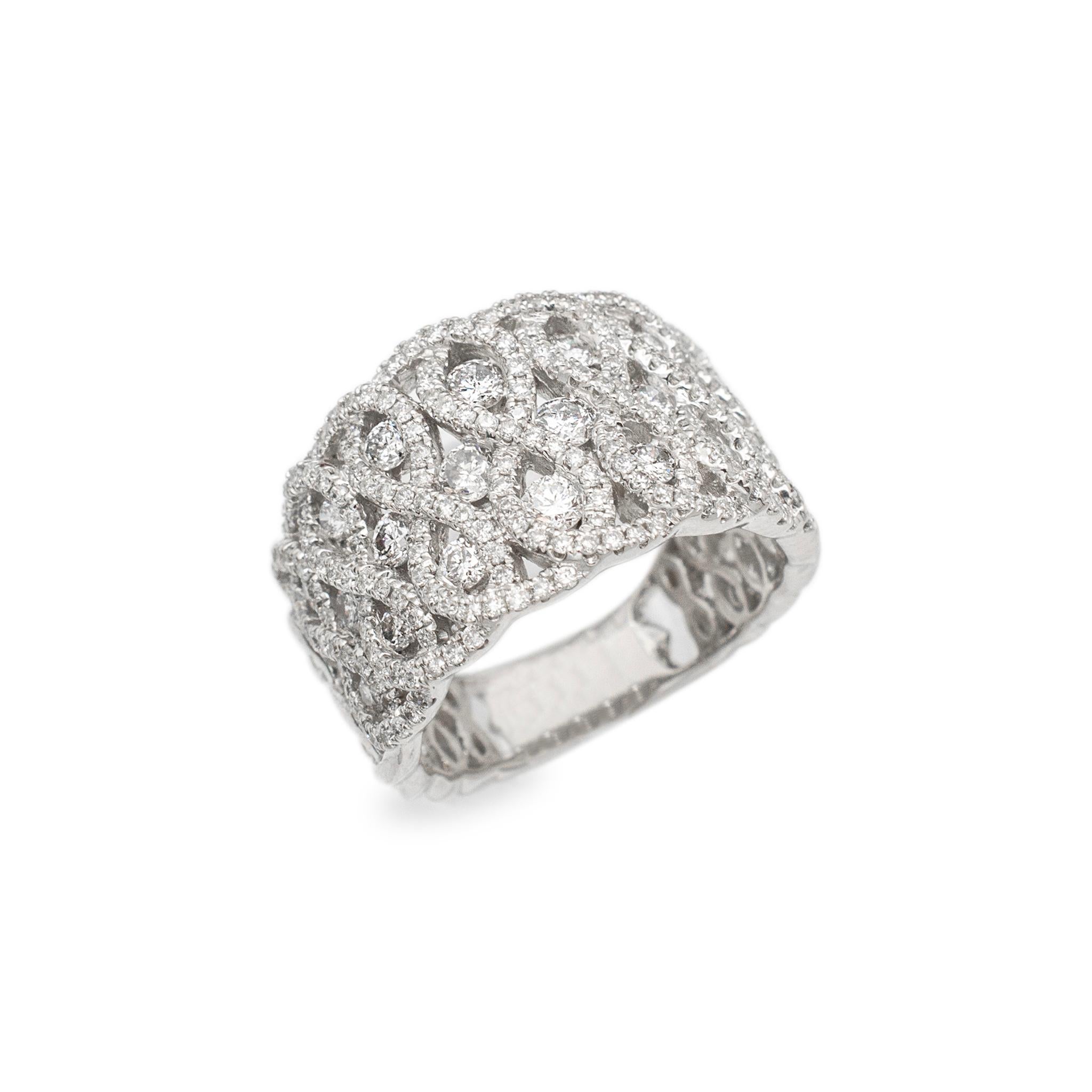 Gender: Ladies

Metal Type: 18K White Gold

Size: 7

Shank Maximum Width: 14.30 mm tapering to 4.95 mm

Weight: 10.20 grams

Ladies 18K white gold diamond cluster band with a half-round shank. The metal was tested and determined to be 18K white