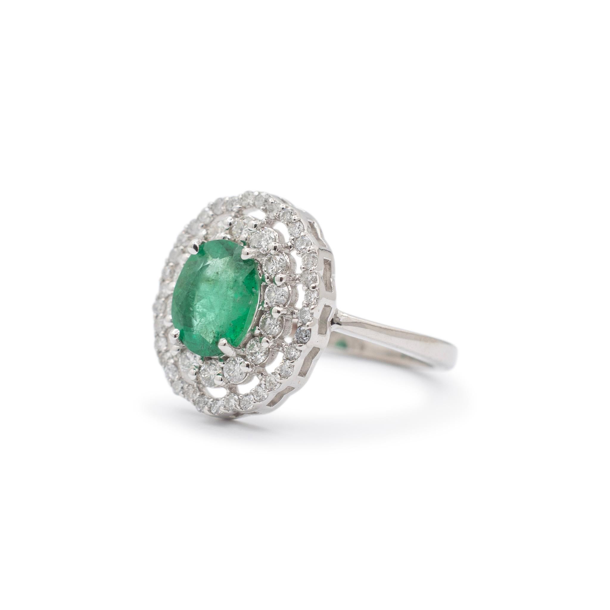 Oval Cut Ladies 18k White Gold Oval Emerald Halo Diamond Cocktail Ring For Sale