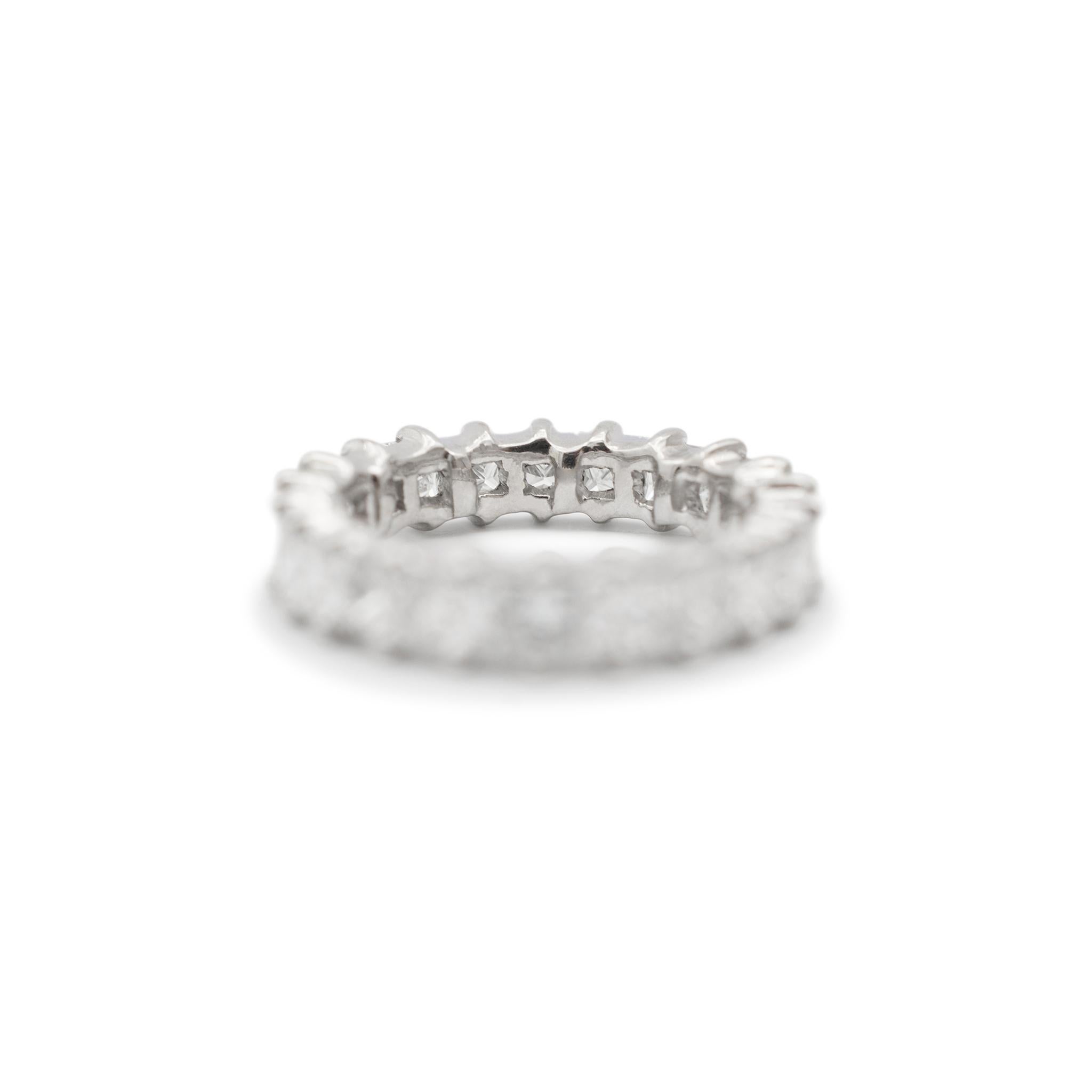 Gender: Ladies

Metal Type: 18K White Gold 

Total Weight: 5.17 grams

Ring Size: 5

Width: 4.50 mm

18K white gold diamond eternity wedding band with a soft-square shank. The metal was tested and determined to be 18K white gold. In excellent