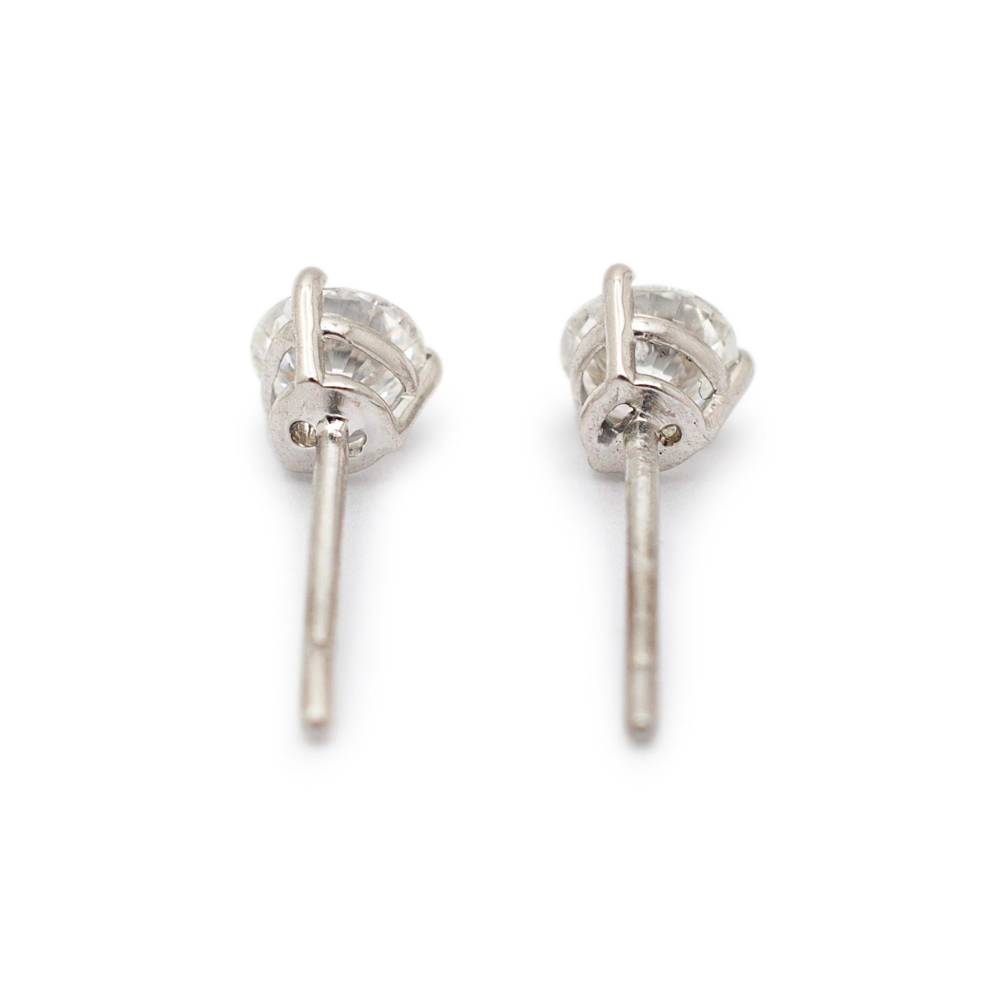 Gender: Ladies

Metal Type: 18K White Gold

Length: 0.50 Inches

Weight: 1.40 grams

18K white gold diamond stud earrings with push backs. The metal was tested and determined to be 18K white gold. Engraved with 