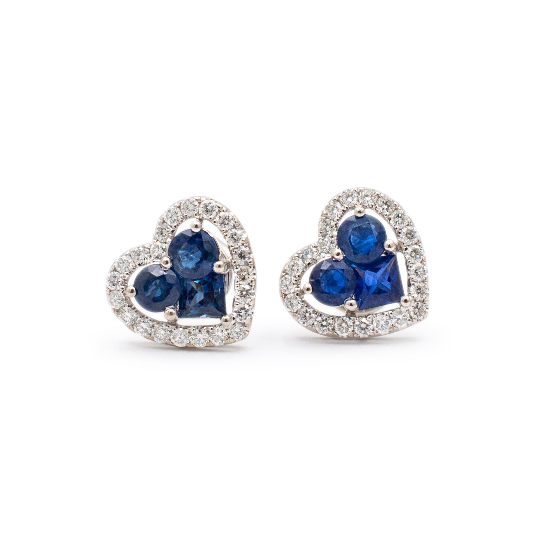 Gender: Ladies

Metal Type: 18K White Gold

Length: 0.50 Inches

Width: 12.75 mm

Weight: 4.30 grams
Ladies 18K white gold sapphire and diamond contemporary-style stud earrings with push backs. Engraved with 