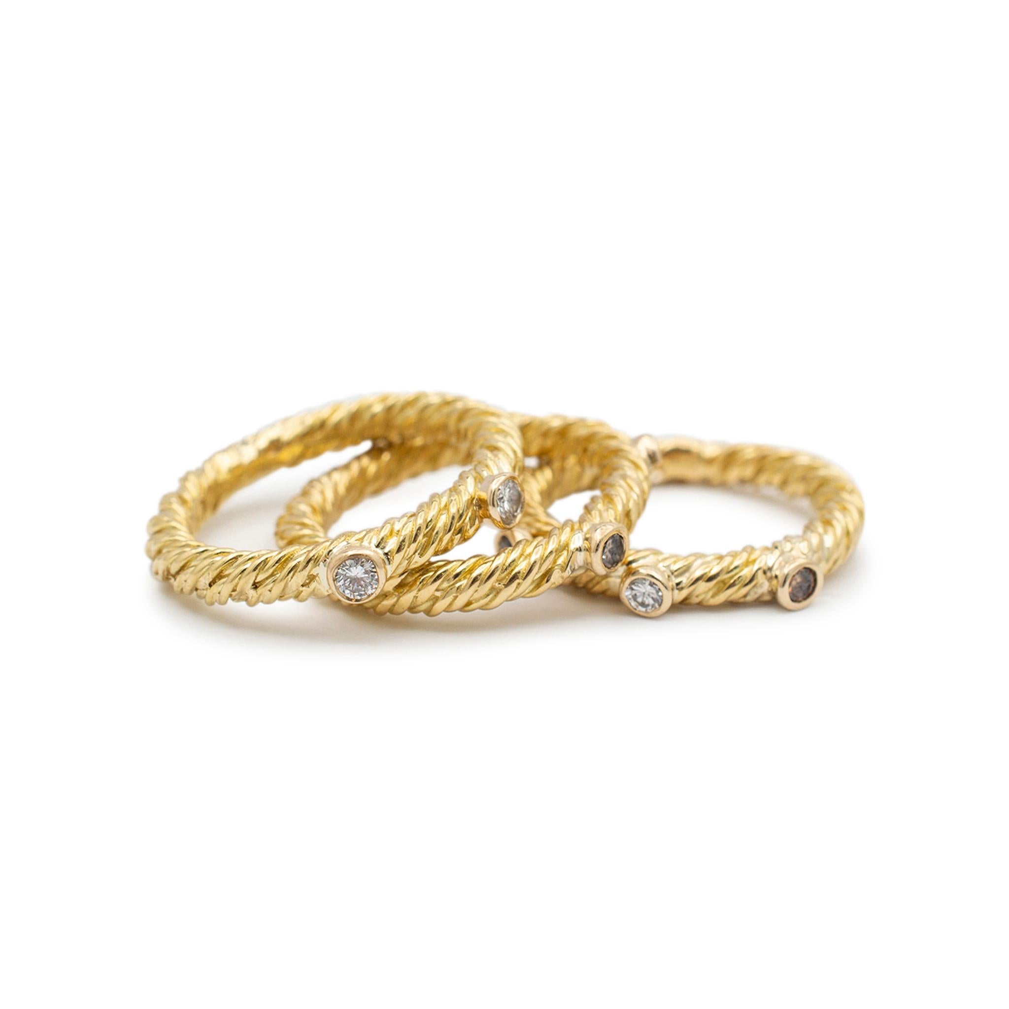 Gender: Ladies

Metal Type: 18K Yellow Gold

Size: 4

Shank Maximum Width: 2.85 mm

Weight: 12.00 grams

Three ladies 18K yellow gold diamond stackable rings with a half round shank. The metal was tested and determined to be 18K yellow