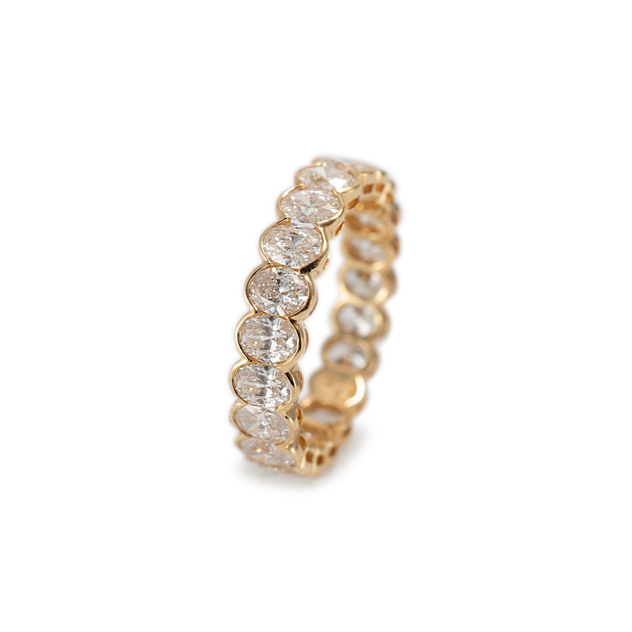 Gender: Ladies

Metal Type: 18K Yellow Gold

Ring Size: 6.5

Width: 4.50 mm

Weight: 2.72 grams

18K Yellow Gold diamond wedding, eternity band with a half-round shank. The metal was tested and determined to be 18K yellow gold. Engraved with 
