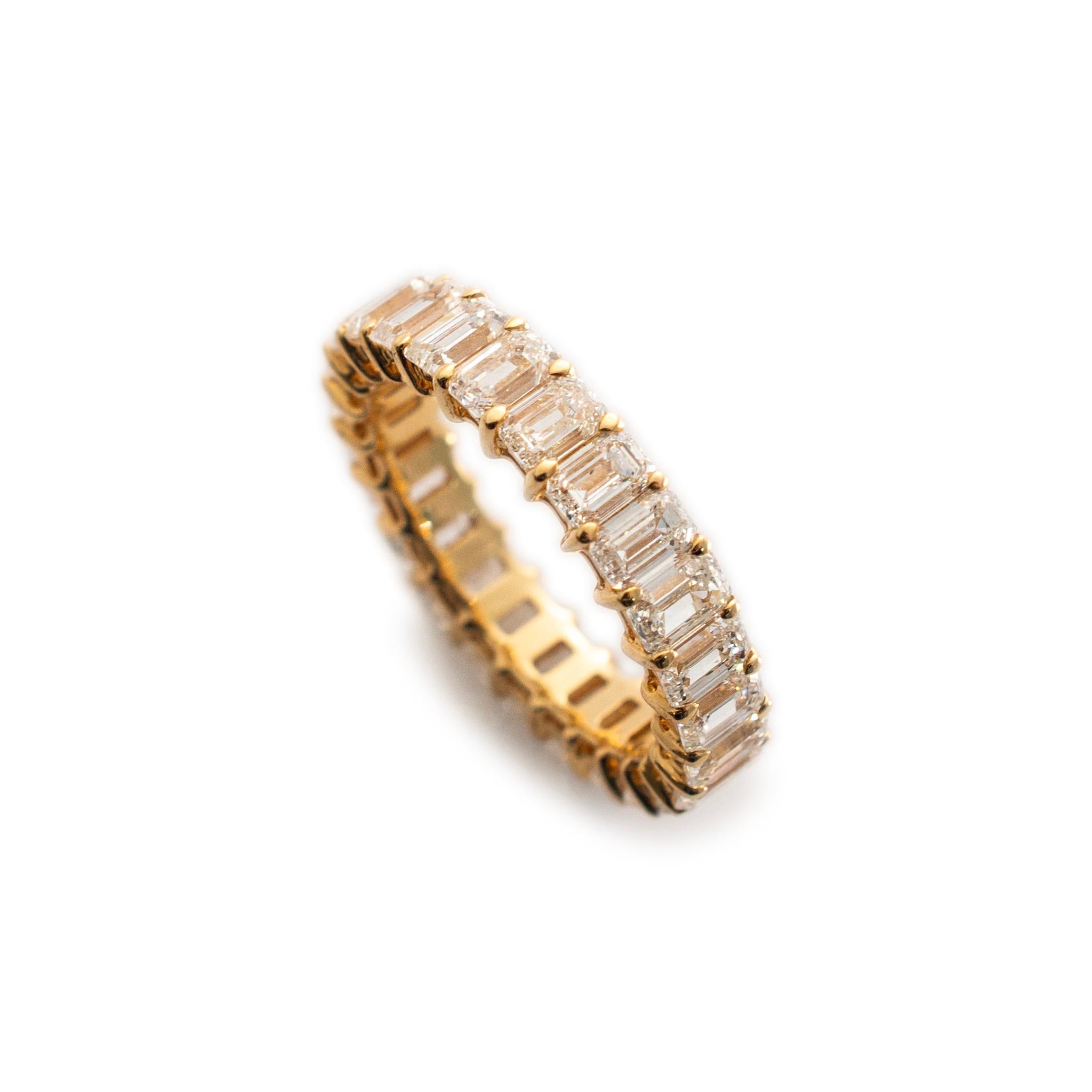 Gender: Ladies

Metal Type: 18K Yellow Gold

Ring Size: 6.5

Width: 4.50 mm

Weight: 3.53 grams

18K Yellow Gold diamond eternity wedding band with a soft-square shank. The metal was tested and determined to be 18K yellow gold. Engraved with 