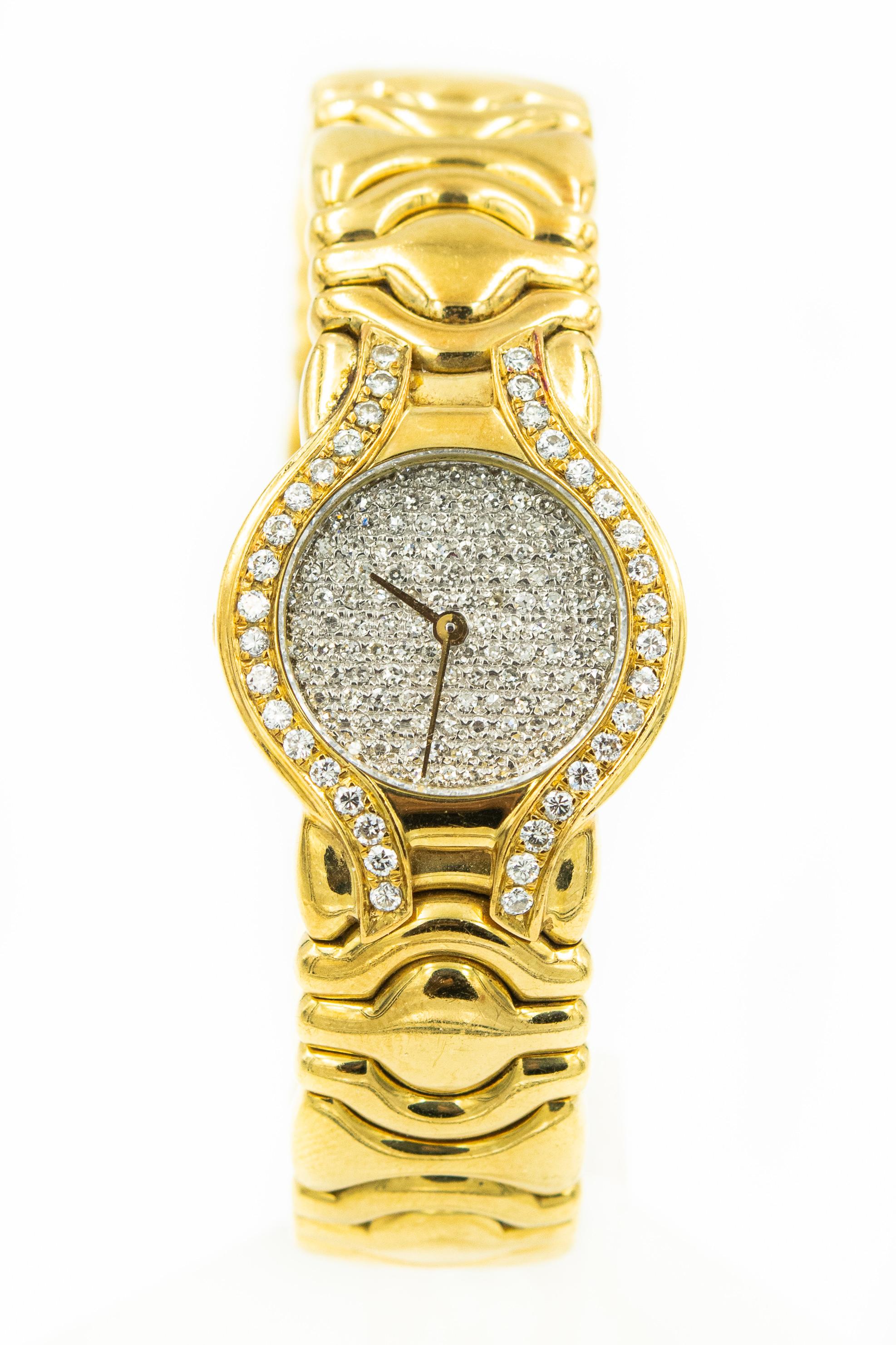  Ladies 18k Yellow Gold Watch with Diamond Face and Bezel The circular dial pavé-set with single-cut diamonds, open ended bangle composed of interlocking geometric links, accented by brilliant-cut diamonds on the bezel.  Made it Italy.
Weight 66.7