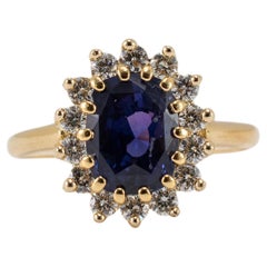 Anillo de cóctel de diamantes con halo de zafiro en oro amarillo de 18 quilates para señora