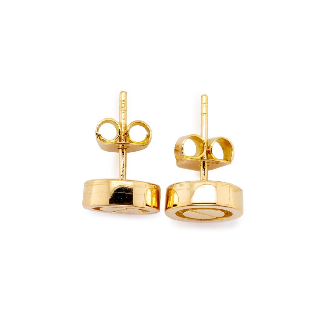 One pair of lady's custom made polished 18K yellow gold, stud earrings with push backs. The earrings measure approximately 0.25 inches in length by 9.00mm in diameter and weigh a total of 3.70 grams. In excellent condition.

SKU: 143147