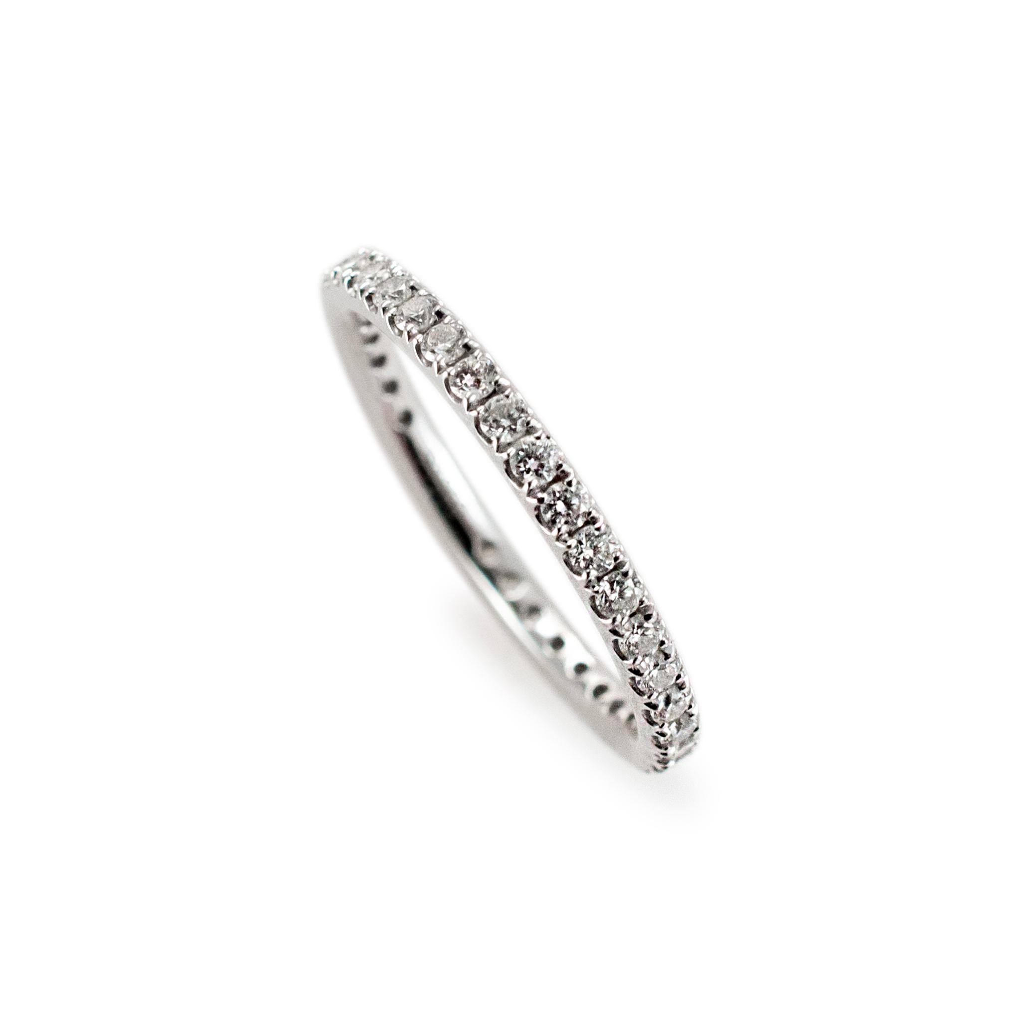 Gender: Ladies 

Metal Type: 950 Platinum

Ring Size: 4.5 

Width: 2.00 mm

Weight: 1.78 grams

One ladies 950 platinum diamond wedding eternity band with a half-round shank. The metal was tested and determined to be 950 platinum. Engraved with