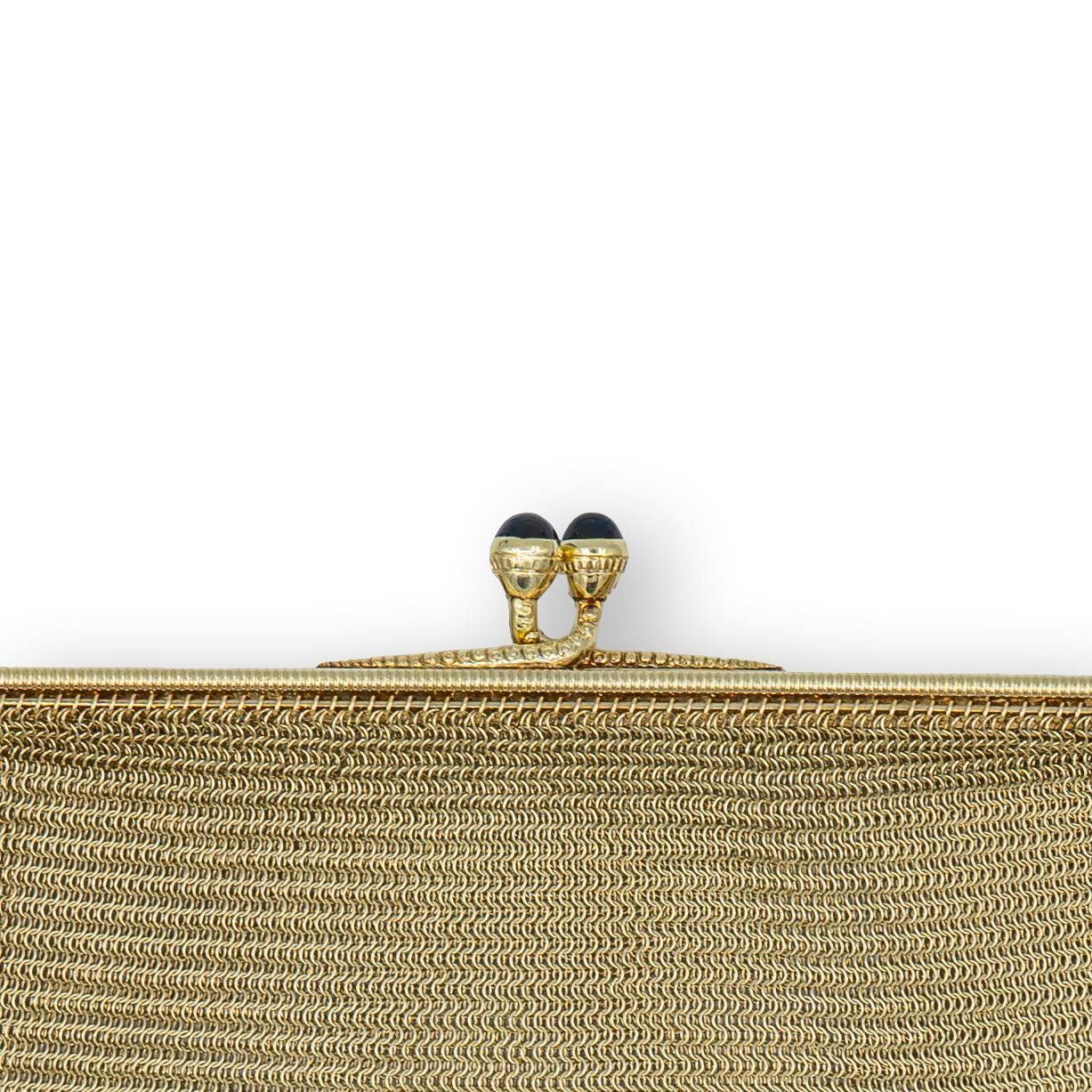 Ladies antique mesh purse from the early 20th century finely crafted in 14 karat yellow gold with a ball snap closure featuring 2 cabochon sapphires, the purse is hanging off a rope gold strap chain measuring 16
