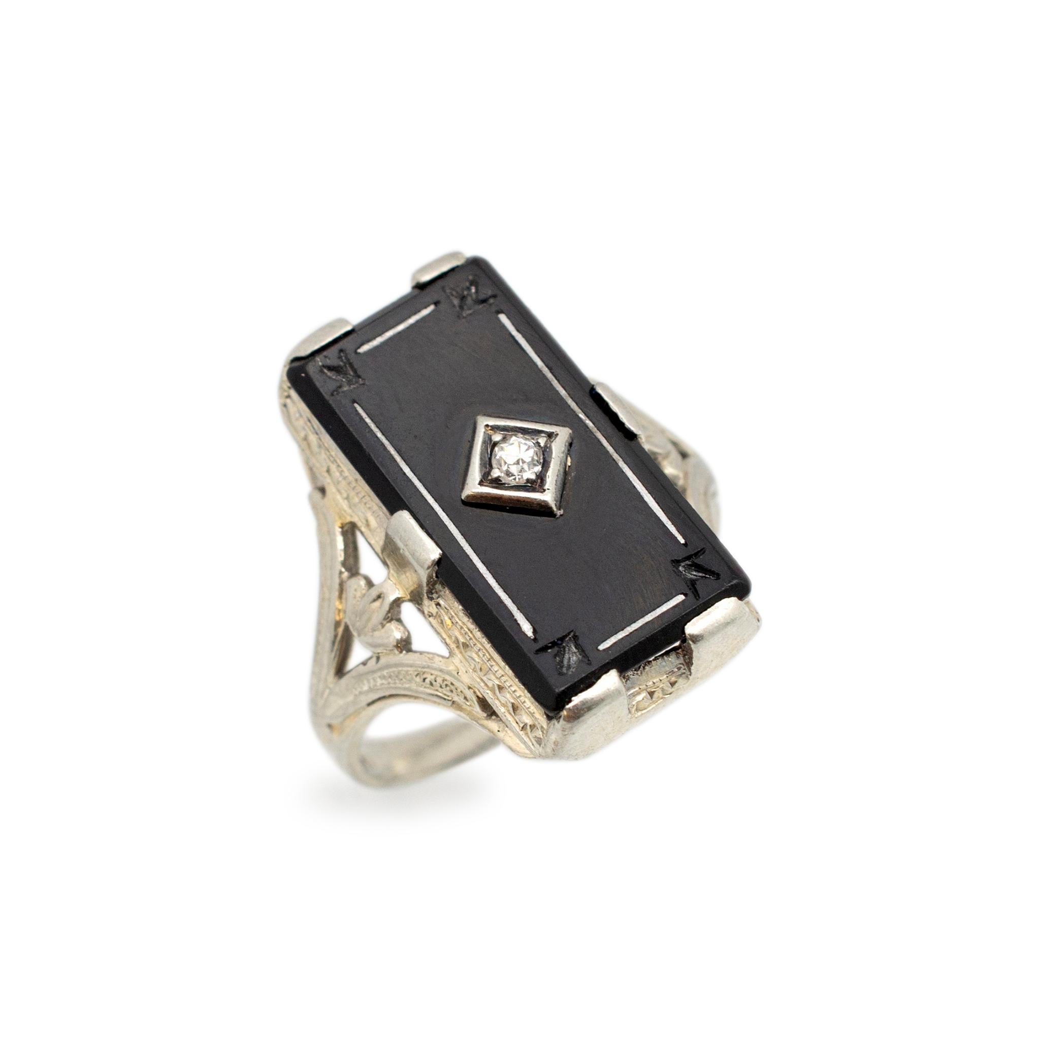 Gender: Ladies

Metal Type: 18K White Gold

Size: 5

Shank Maximum Width: 1.85 mm

Weight: 4.54 grams

Ladies 18K white gold diamond and onyx antique cocktail ring with a split euro-shank. Engraved with 