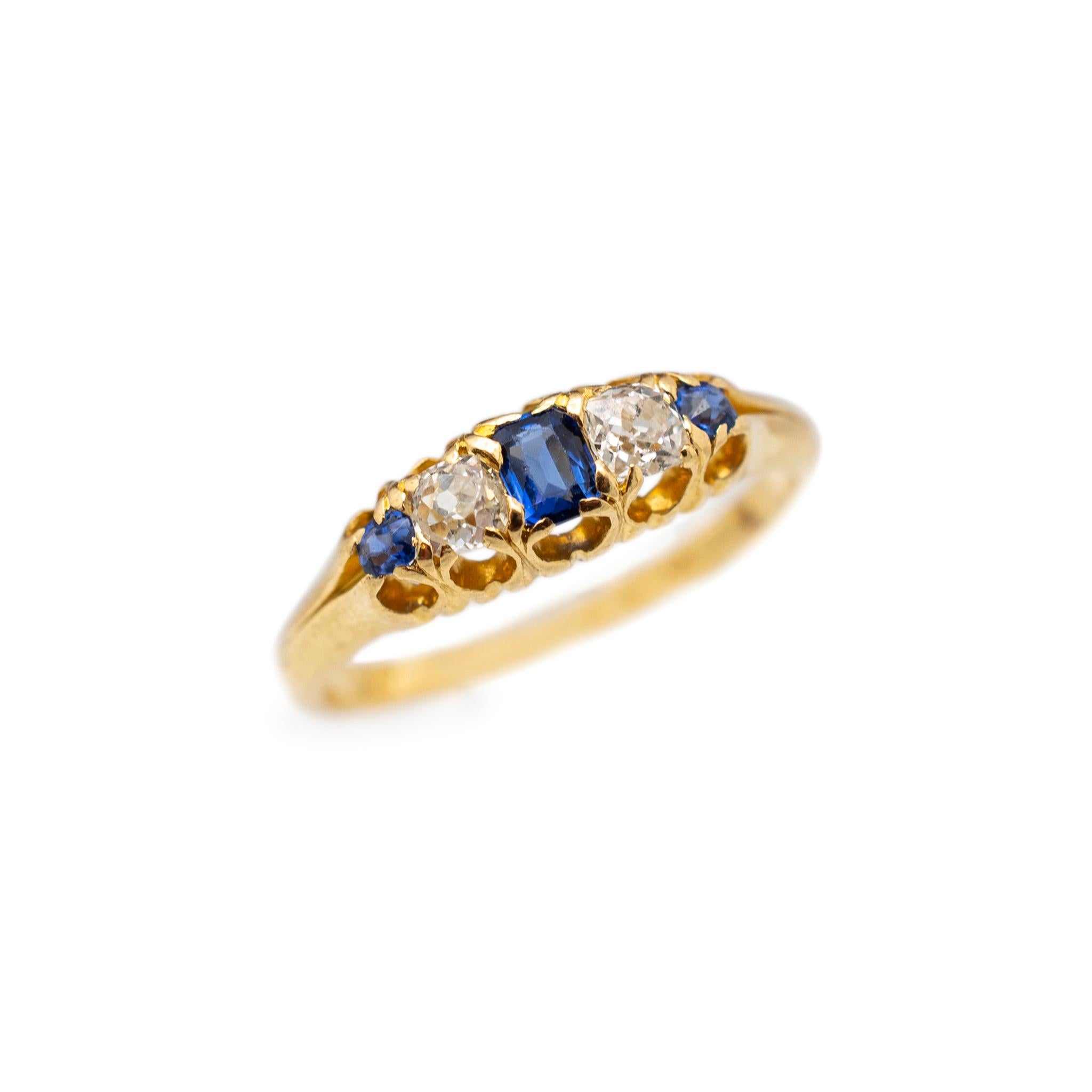 Gender: Ladies

Metal Type: 18K Yellow Gold

Size: 6

Shank Maximum Width: 5.20 mm tapering to 1.60 mm

Weight: 2.88 grams

Ladies 18K yellow gold diamond and sapphire antique cocktail ring with a half round shank.

Antique. Pre-owned in excellent
