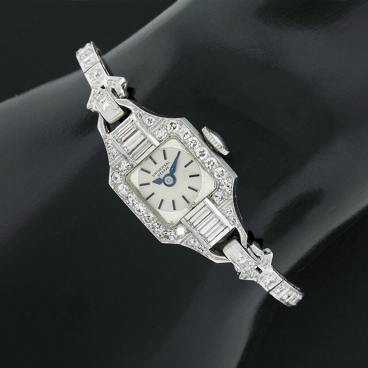 Here we have an antique, ladies', Universal Genève wrist watch crafted from solid .900 platinum. It is covered with approximately 2.25 carats of breathtaking fine quality diamonds throughout. The case is channel set with sets of 3 straight baguette