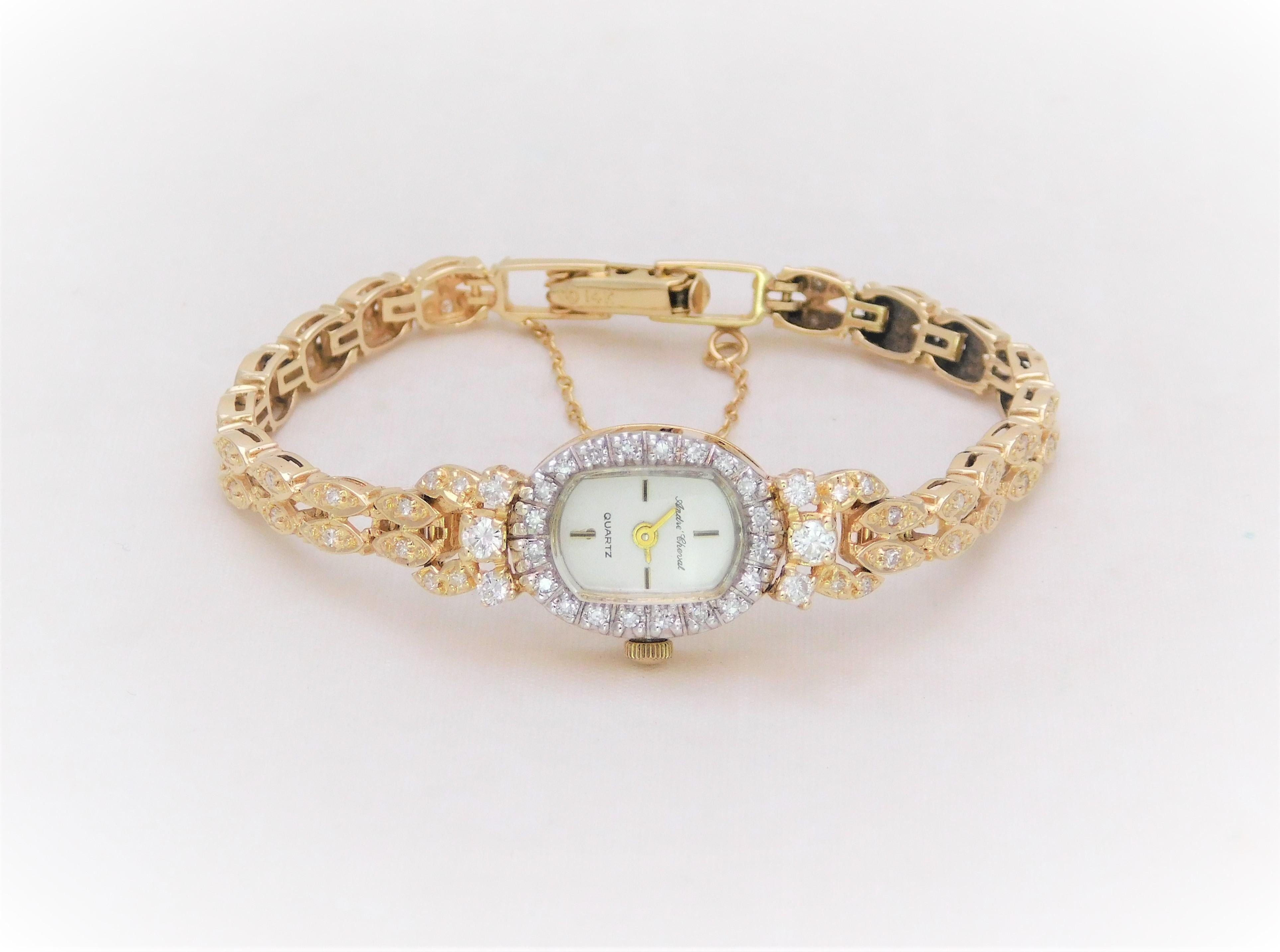 From a lovely Southern estate. This gorgeous  Andre Cheval ladies timepiece has been crafted in solid 14k yellow gold.  This was an uncommon color as most of the timepieces created in this style were in white gold or platinum.  
The elegant diamond