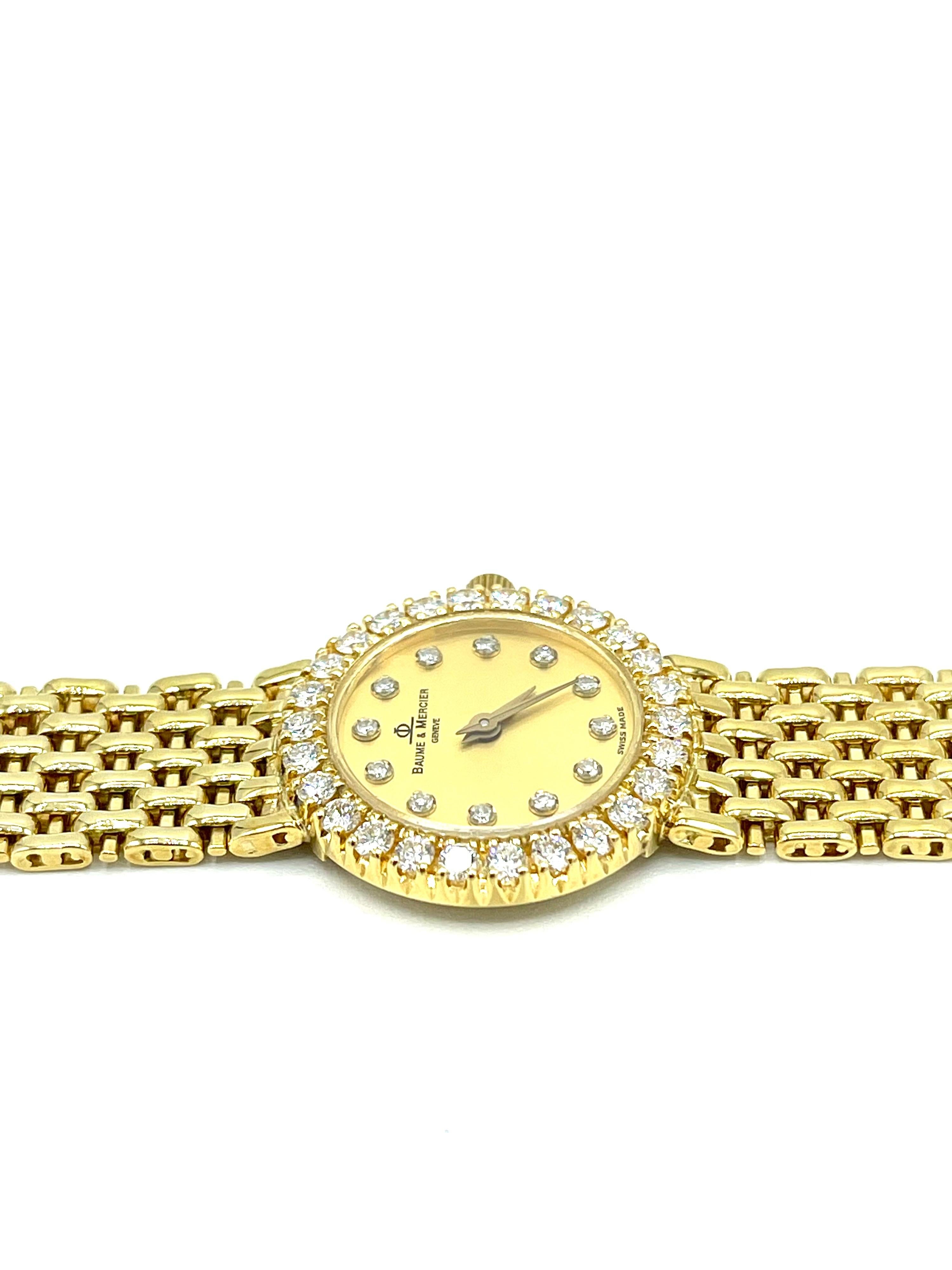 A beautiful ladies 18k gold Baume & Mercier watch.  The watch contains Diamond markers on the dial and a Diamond bezel, on a beautiful mesh bracelet of 18k yellow gold.  There is 1.10 carats in Diamonds.  The back of the case is stamped 