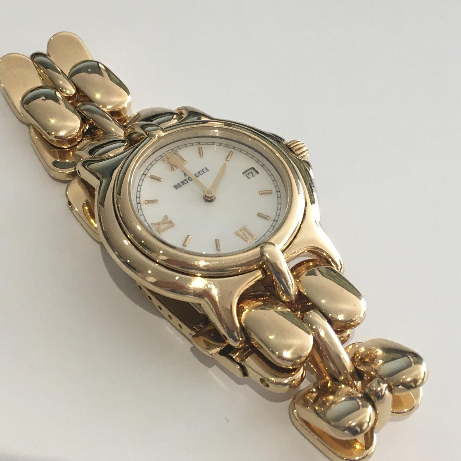 Ladies Bertolucci 18k yellow gold watch with mother of pearl dial.

Stamped 18k, 750 and weighs 102 grams.

Precision Swiss quartz movement with date.
Water resistant to 100 feet.
The case diameter is 25mm.
Adjustable clasp.
Pre-Owned and in