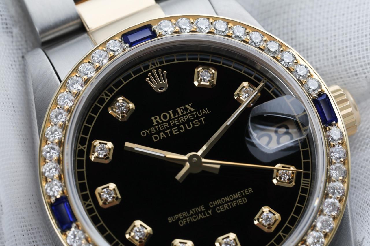 Ladies Black 31mm Rolex Datejust 2 Tone Diamonds + Sapphire Bezel 68273

This watch is in like new condition. It has been polished, serviced and has no visible scratches or blemishes. All our watches come with a standard 1 year mechanical warranty