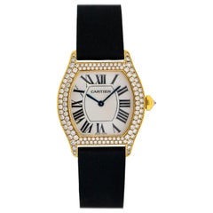 Cartier Montre tortue en or jaune 18 carats et diamants, pour femmes WA503751