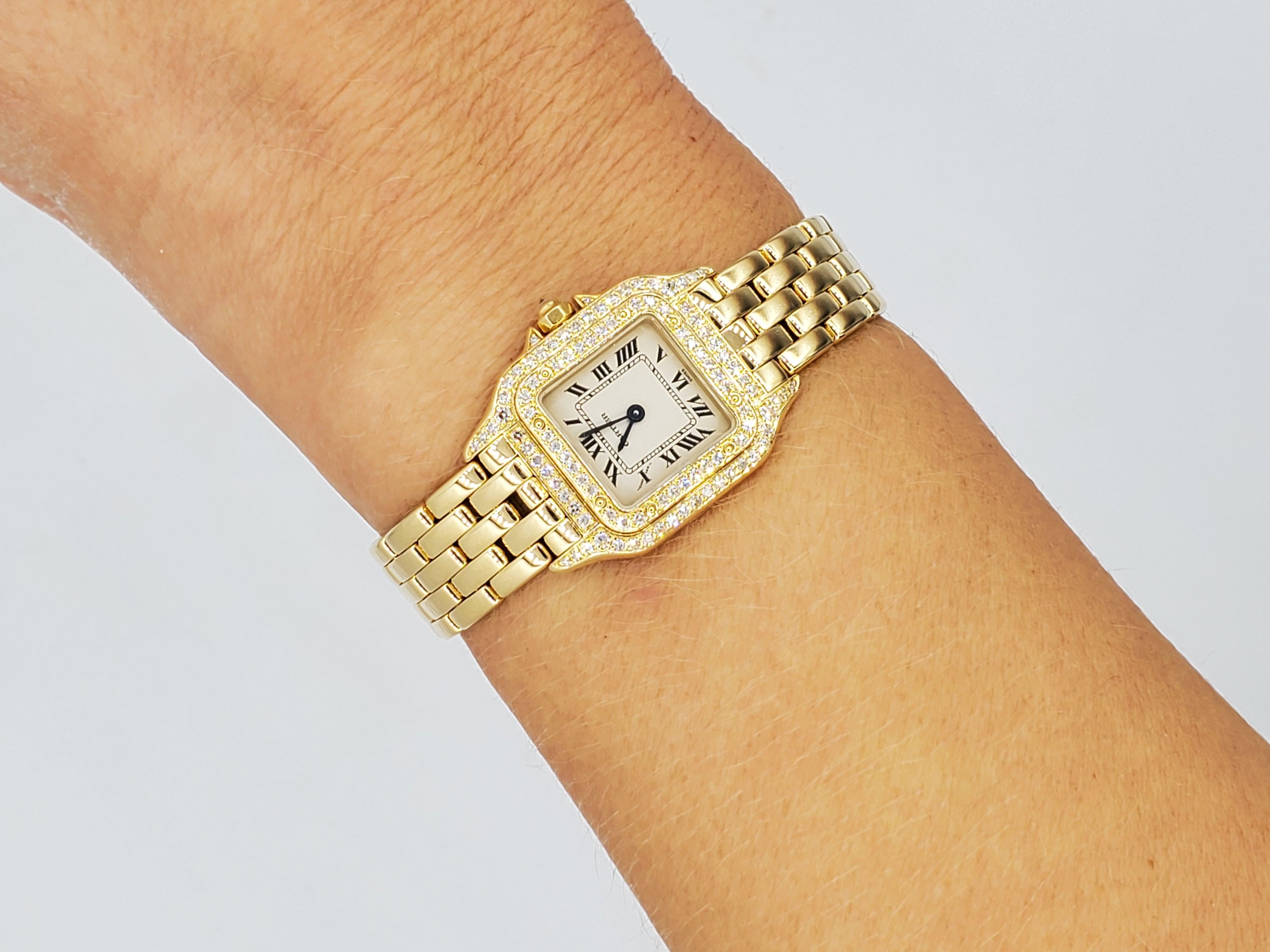 Cartier ladies 18kt yellow gold Panthere watch with single cut diamonds of approximately 1.00cttw. The diamonds are f/g color and vs clarity. Versatile champagne face. 69 grams total weight. The bracelet is 2.75 inches on each side. The back of the