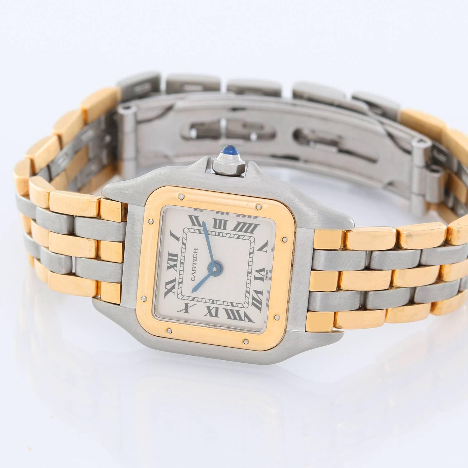 Ladies Cartier 3-Row Panther 2-Tone Steel & Gold Watch -  Quartz. Stainless steel case with 18k yellow gold bezel (22mm x 30mm). Ivory colored dial with black Roman numerals. Stainless steel and 18k yellow 3-row Cartier Panther bracelet. Pre-owned