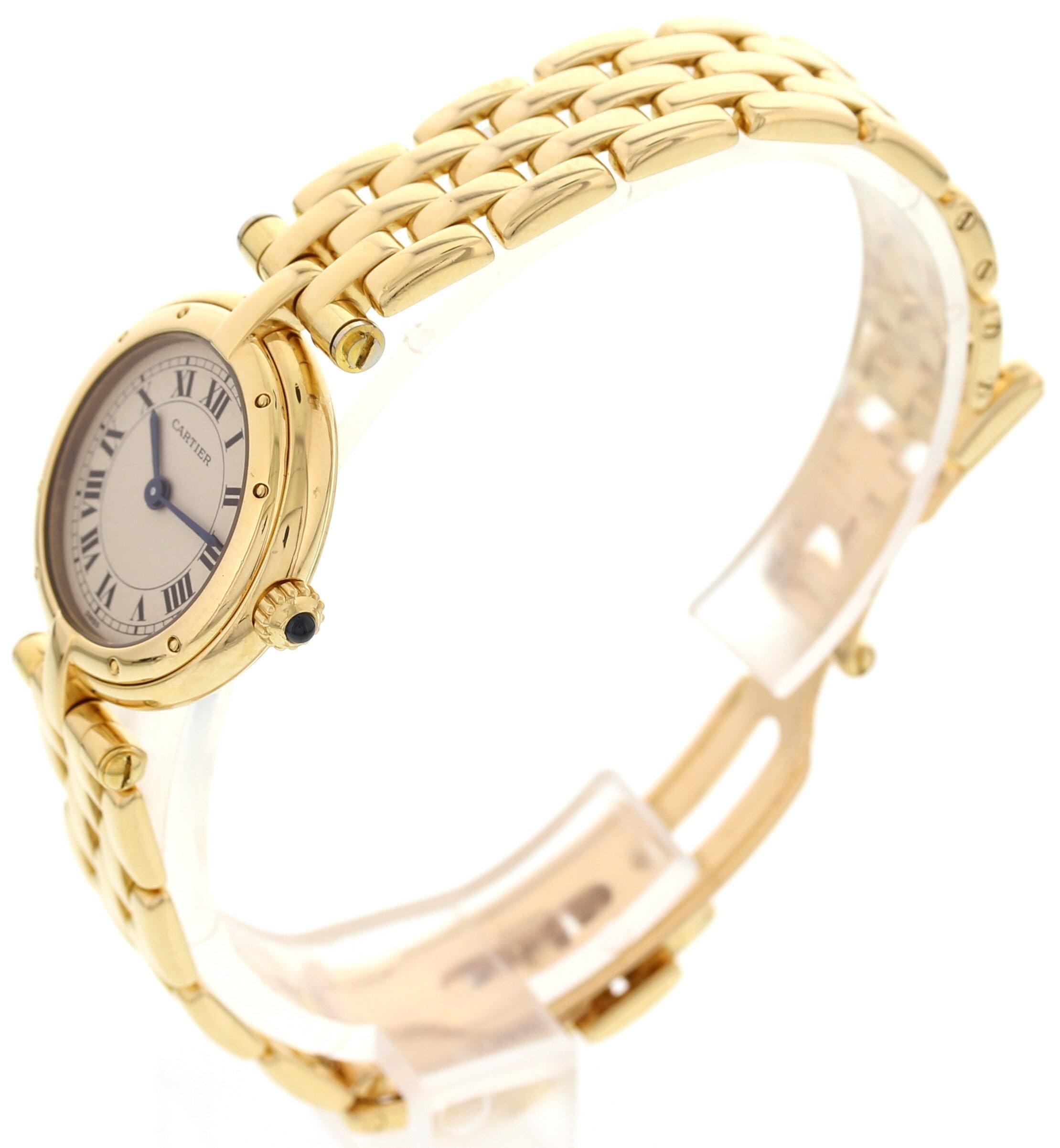 Ladies Cartier Cougar watch. 23 mm 18k yellow gold case. 18k yellow gold bezel. White dial with blue hands and black Roman numerals. Water resistant. 18k yellow gold bracelet with hidden double folding clasp; will fit a 5.5 inch wrist. Quartz
