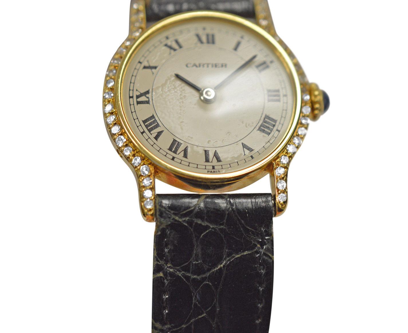Brand	Cartier
Model	Ronde Paris W6000158
Gender	Ladies
Condition	Pre-owned
Movement	Swiss Mechanical
Case Material	18K Yellow Gold
Bracelet / Strap Material	
Aligator/Crocodile

Clasp / Buckle Material	
18K Yellow Gold	
Clasp