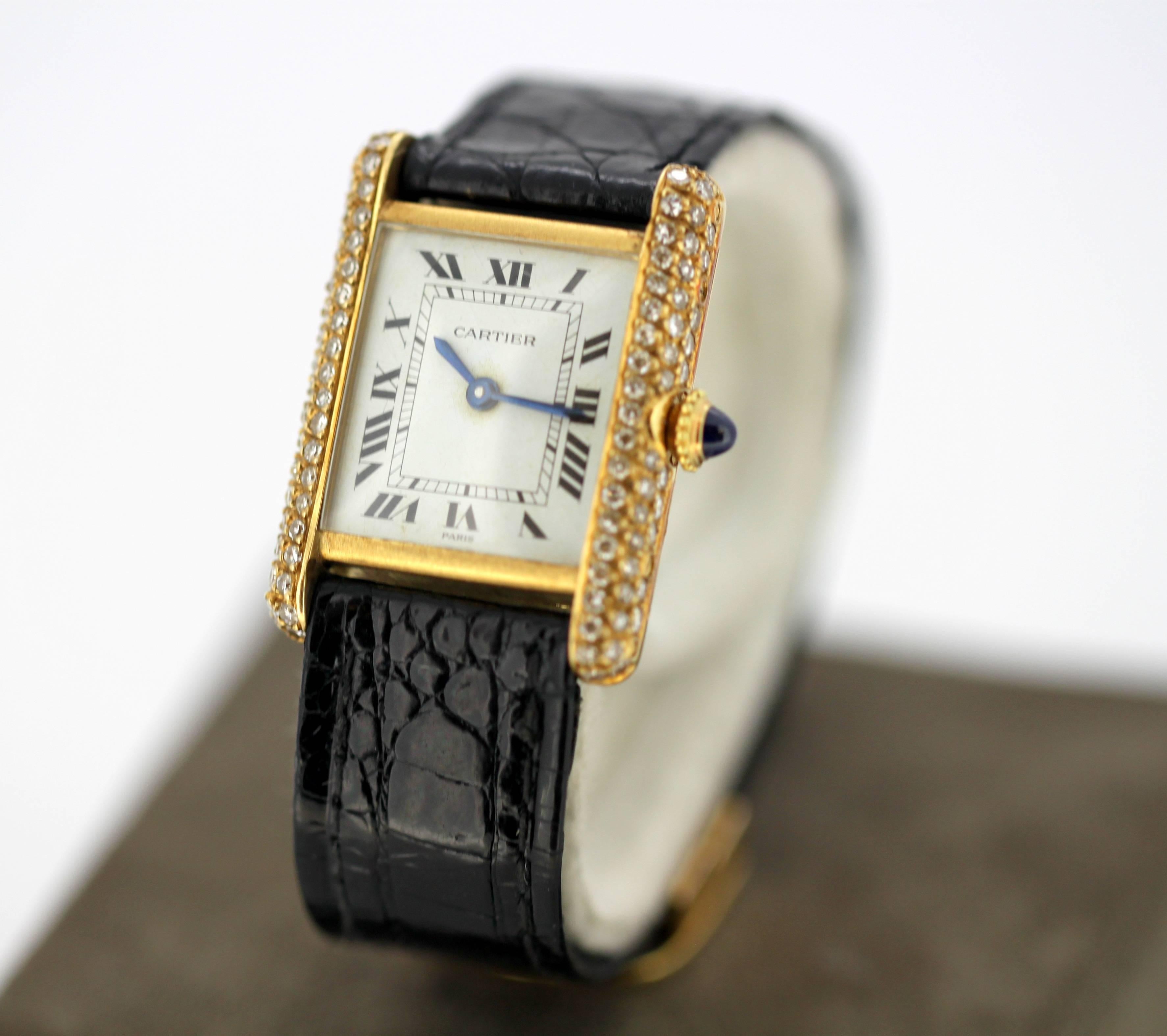 Vintage Ladies Cartier Tank Louis watch in 18k gold and bezel set with diamonds, Circa.1960's

Gender: Ladies
Case Size : 28 x 26 mm
Movement: Manual Winding
Watchband Material: 18k gold buckle and leather strap. (Original by Cartier)
Case material