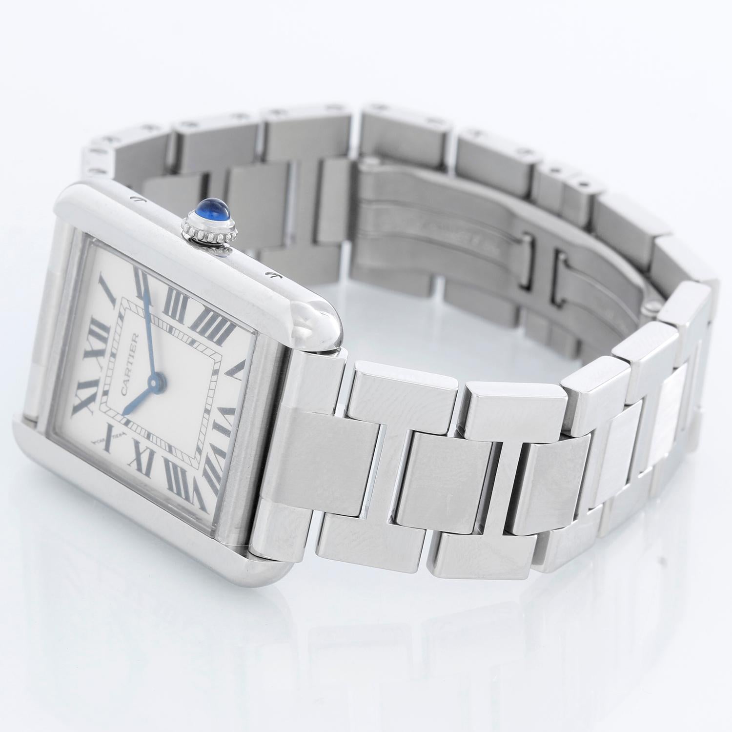 Ladies Cartier Tank Solo Stainless Steel Watch W5200013 3170 - Quartz. Stainless steel case (24mm x 30mm). Silver dial with black Roman numerals. Stainless steel bracelet (will fit apx. 6 1/4 inch wrist). Pre-owned with Cartier box. 