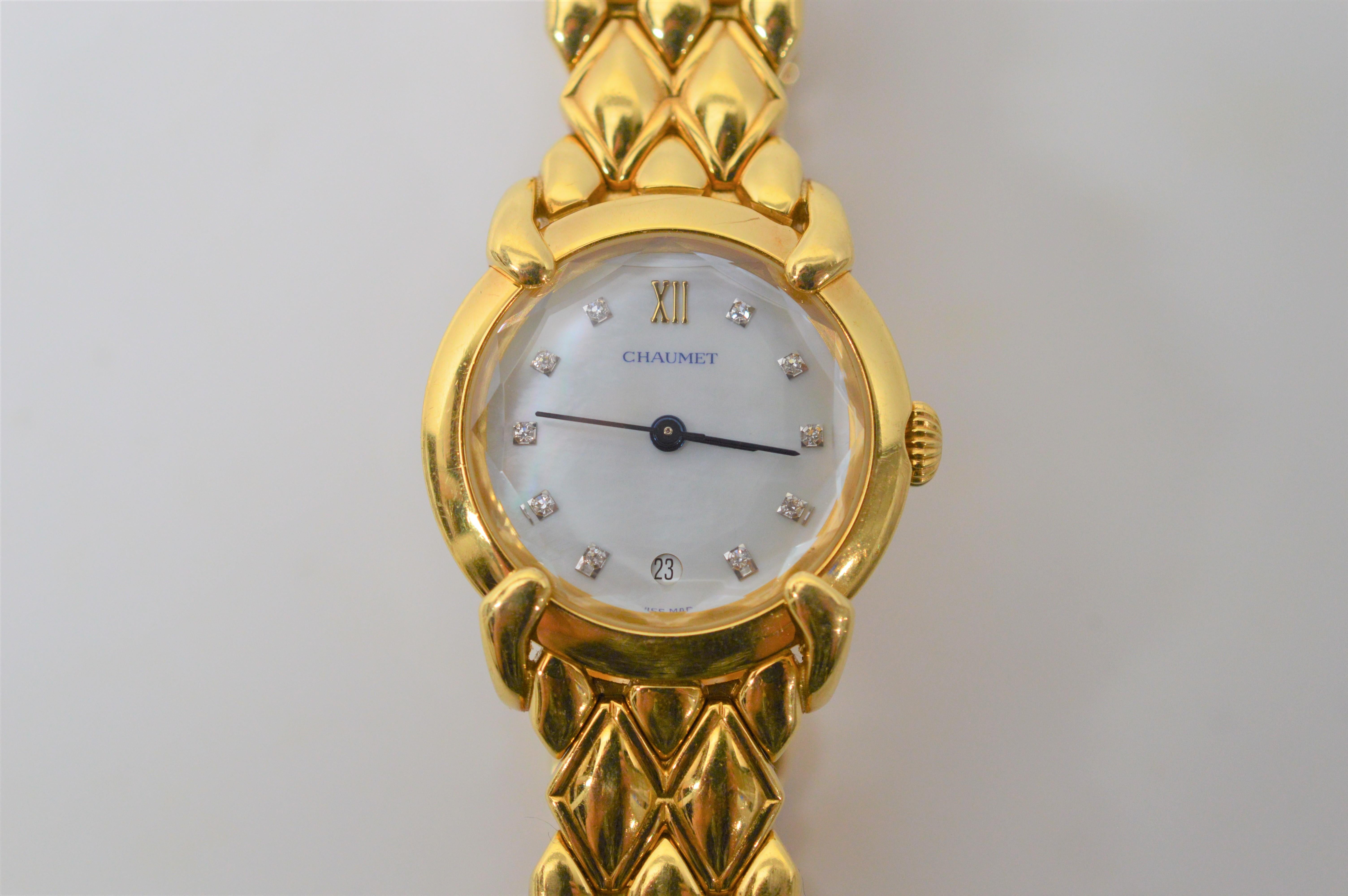 18 Karat Yellow Gold and Diamond Ladies Chaumet Paris Elysses Quartz  Bracelet Watch. Diamonds mark each hour on the 24mm Mother of Pearl watch face. The substantial 18 karat yellow gold band is outfitted with a disappearing hinge closure and the