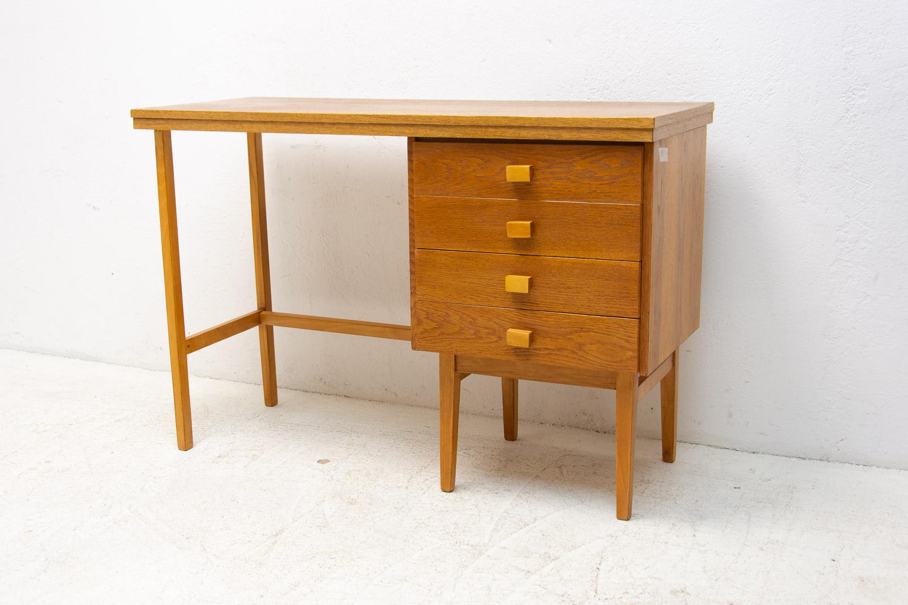 A Simple beech wood writing desk from the HIKOR Písek company, 1980´s, Czechoslovakia
The design is very simple and elegant. It features a section with 4 drawers. The surface of this desk has been fully restored and is in very good