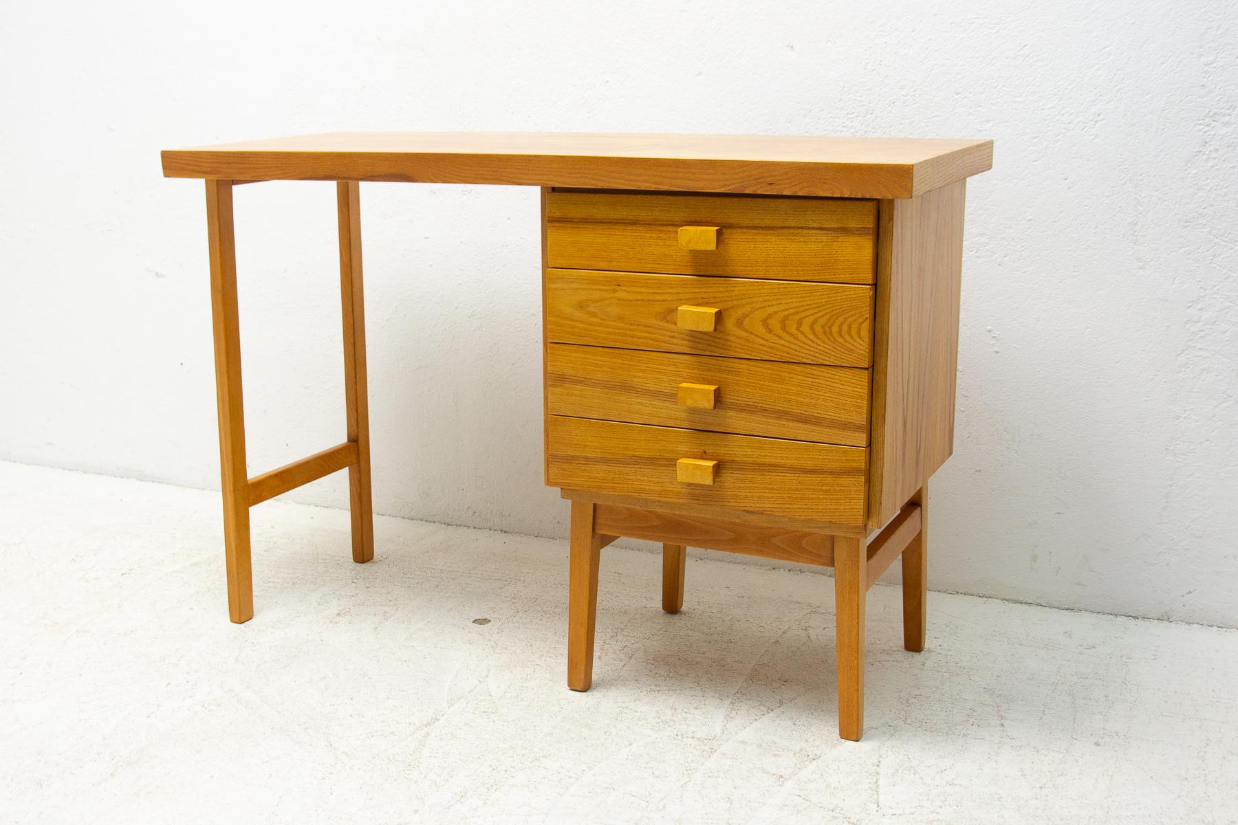 A Simple beech wood writing desk from the Hikor Písek company, 1980´s, Czechoslovakia
The design is very simple and elegant. It features a section with 4 drawers. The surface of this desk has been fully restored and is in very good