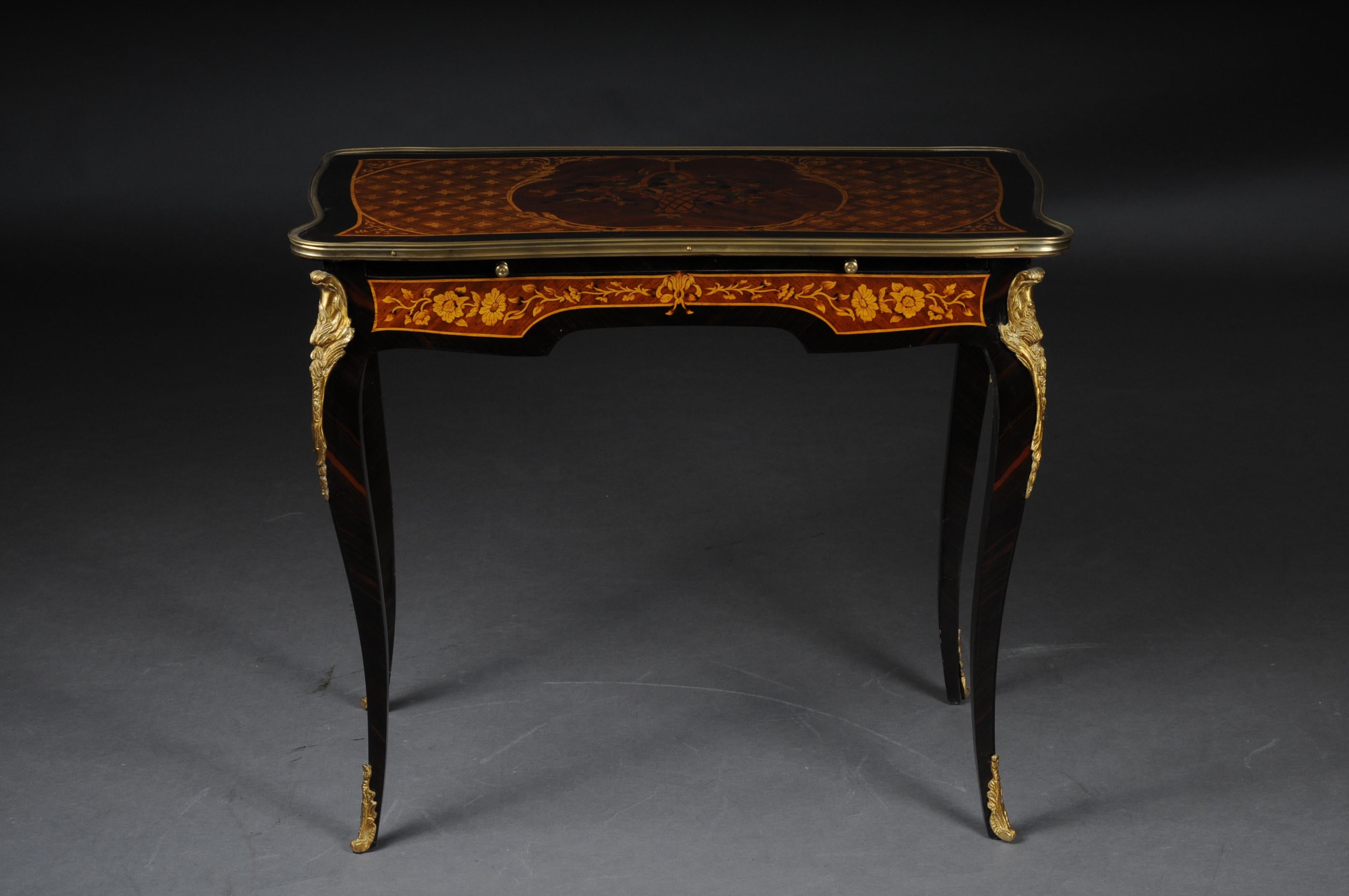 Ladies desk or table in Louis Quinze style.
 
Inlays on solid softwood. Ending high, curved square legs in sabots. Slightly overhanging, framed in wide, matching profiles, tabletop with inset filigree maple inlays. Full-surface mirrored veneer on