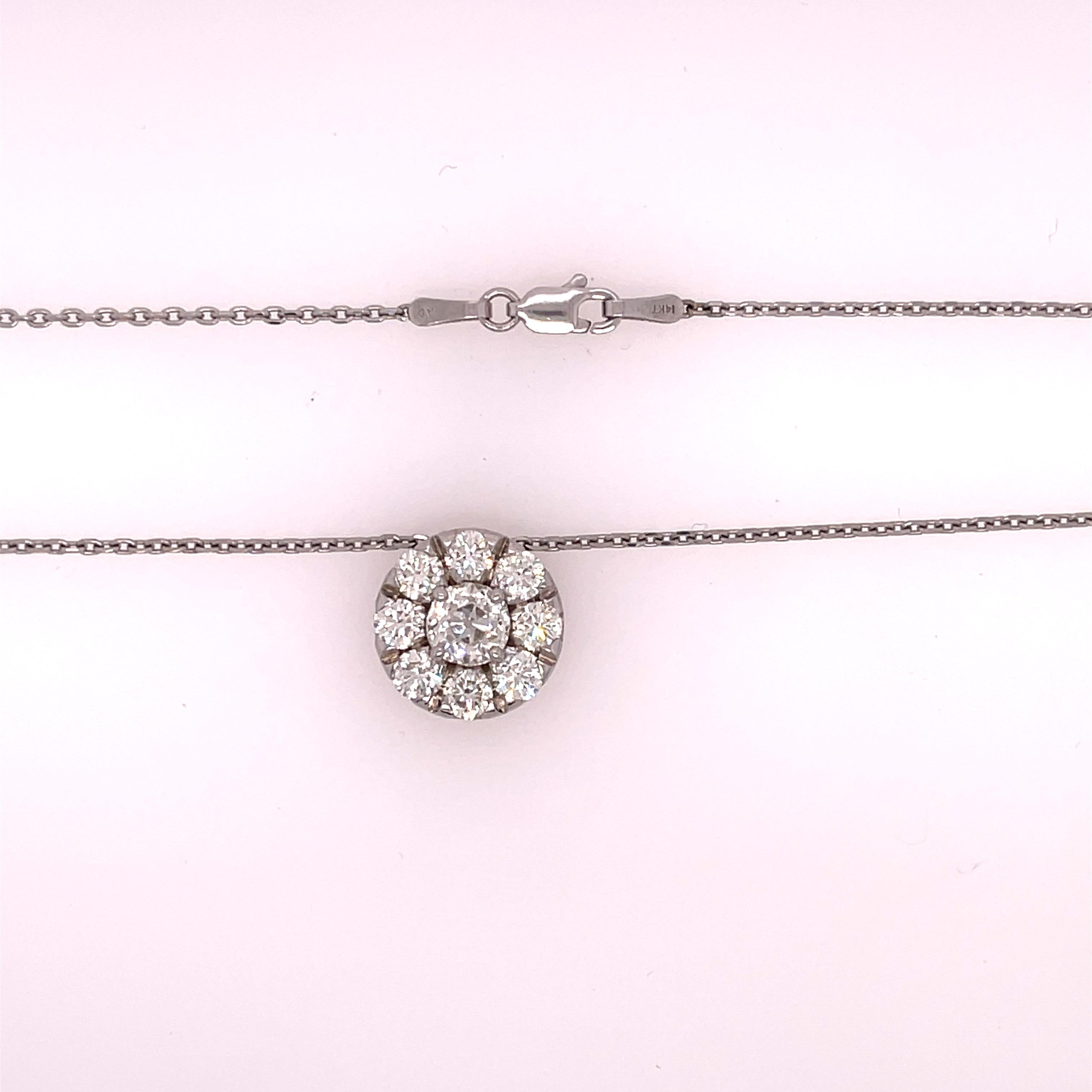 Ladies 14K white gold diamond cluster pendant necklace featuring a 1 carat euro cut diamond in the center. The halo features 8 brilliant round cut diamonds with a total weight of 1.52ct, I color and VS in clarity. The pendant is on a 16 inch 14k