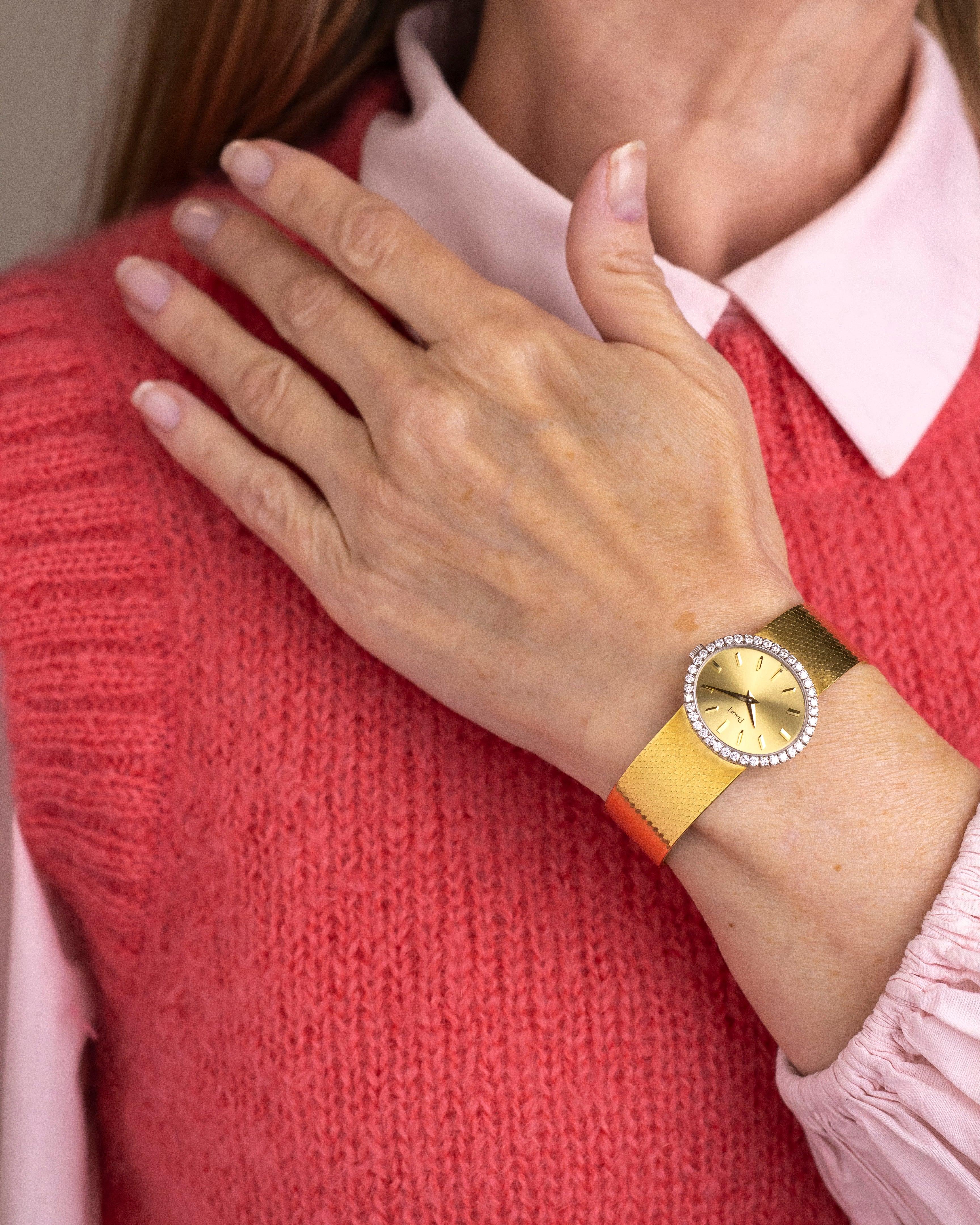 This beautiful ladies dress watch was made by Swiss watchmaker Piaget. Crafted from 18 karat yellow gold the watch features an integrated 18 karat yellow gold bracelet which is original to the piece and has a silky satin finish. The oval watch-face