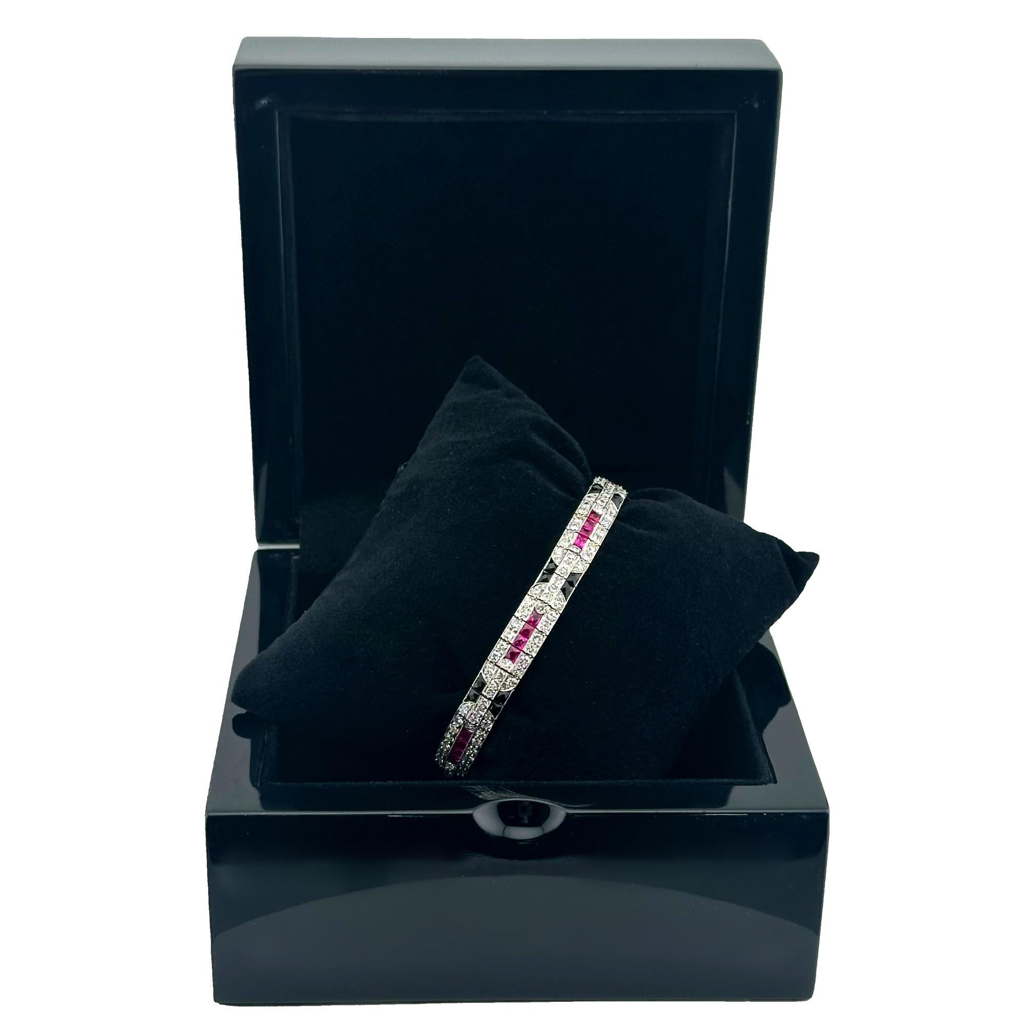 Ladies Diamonds Rubies Onyx Art Deco Style Bracelet
Style:  Tennis 
Metal: Platinum
Size:  7 Inches - 7 mm wide
Main Diamond:  190 Antique Single Cut Diamonds
Accent GemStone:  28 French Cut Synthetic Rubies
Accent Gemstone:   28 French Cut Black
