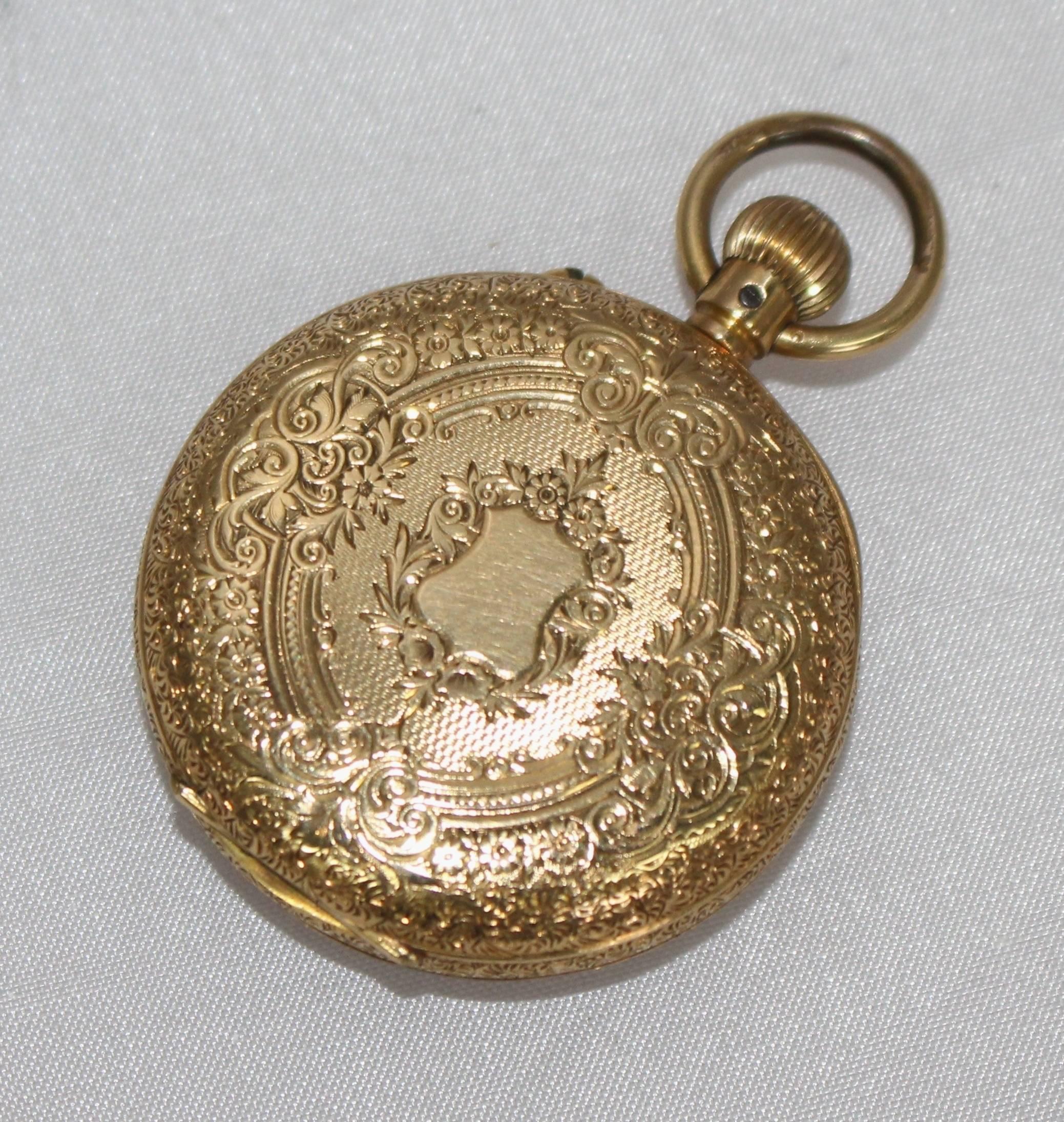 Period Late Victorian
Measures: Width 38 mm
Height (to top of bow) 53 mm
Weight 45.2 g
Case 18 carat gold, engraved to whole, case-in-case, top winder. Engraved 'S.A.Hawkins' inside, hallmarked 18 carat
Dial Chapter ring with black Roman